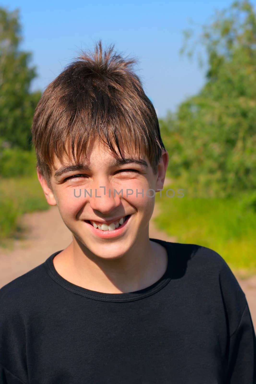 smiling young and happy boy portrait outdoor