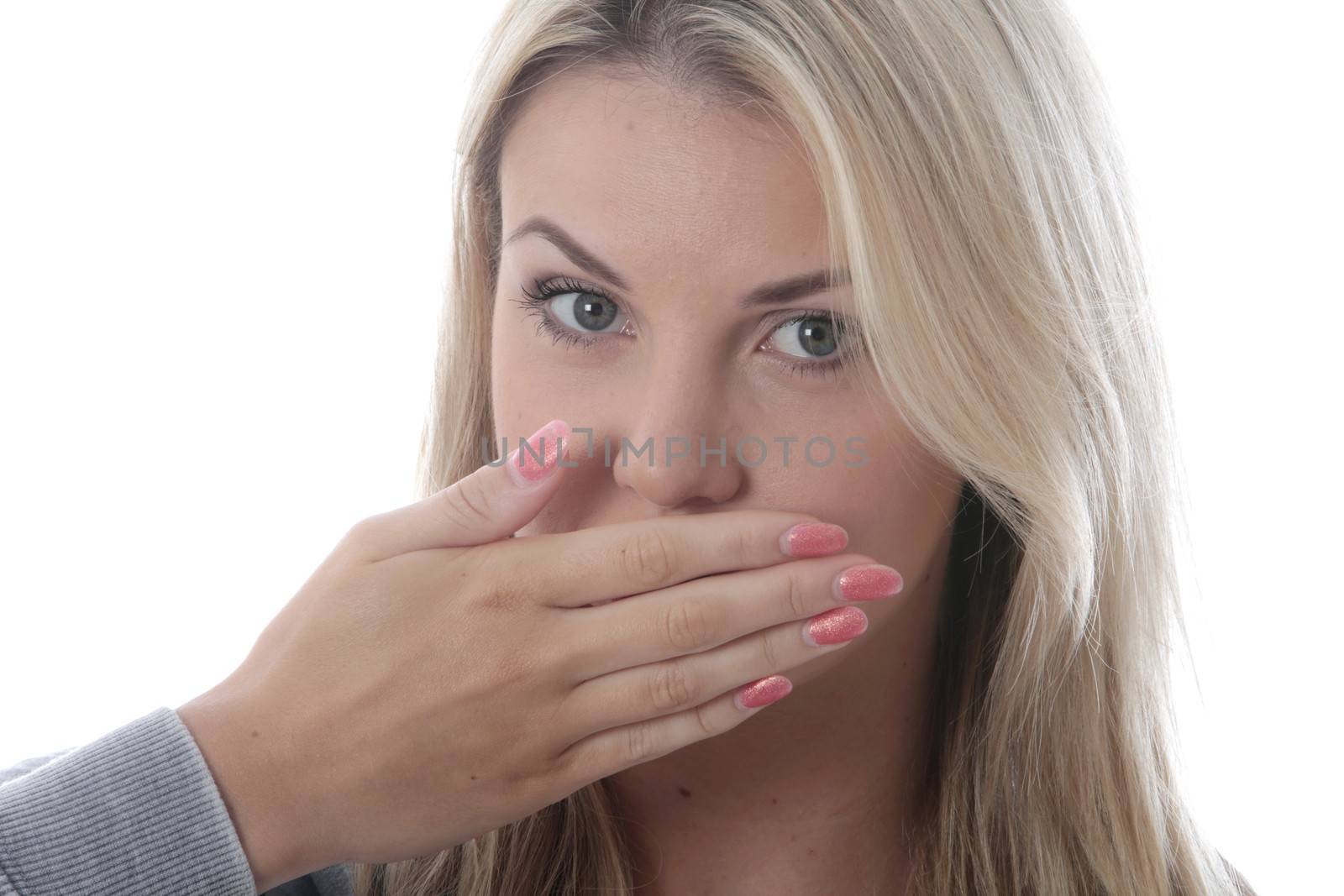 Model Released.  Young Woman Covering Her Mouth