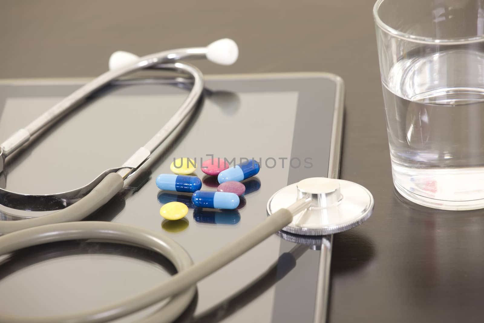 Doctor workplace with digital tablet and stethoscope