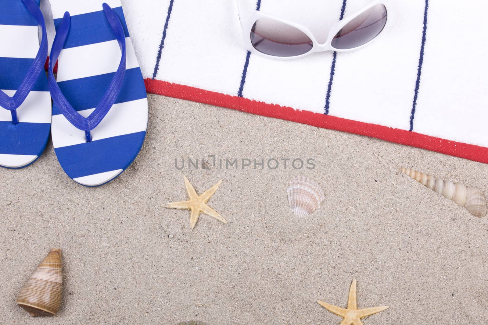 beach items on a towel and sand by senkaya