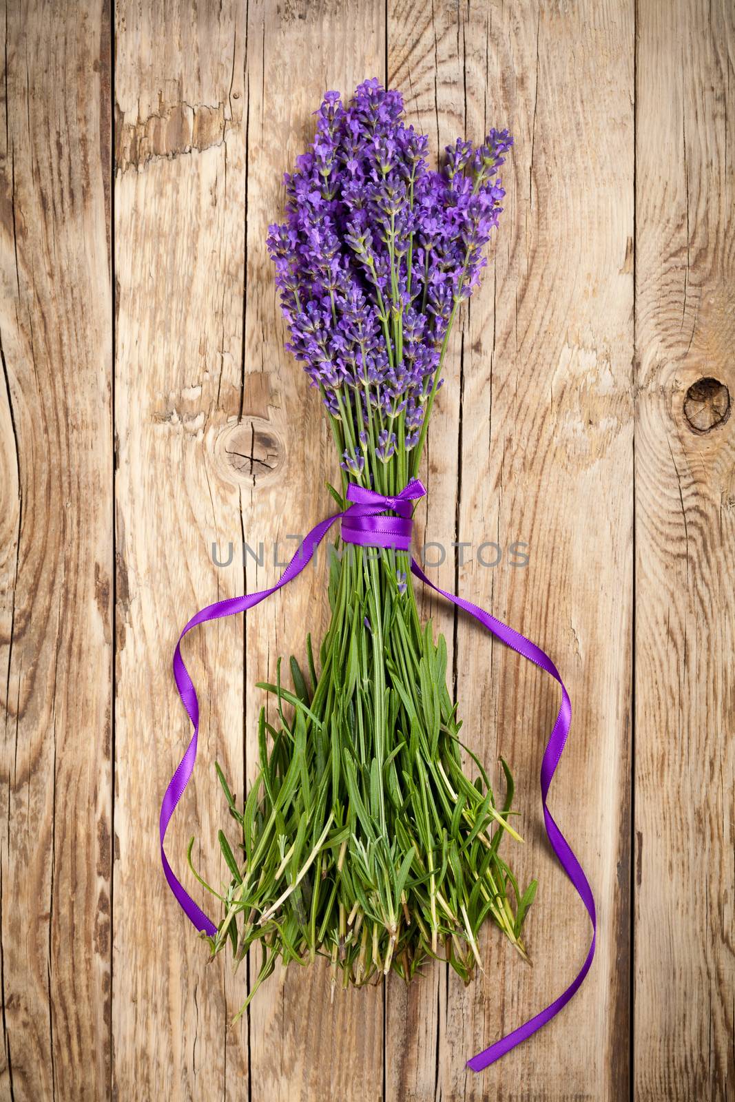 Lavender flowers on wooden table background. Top view