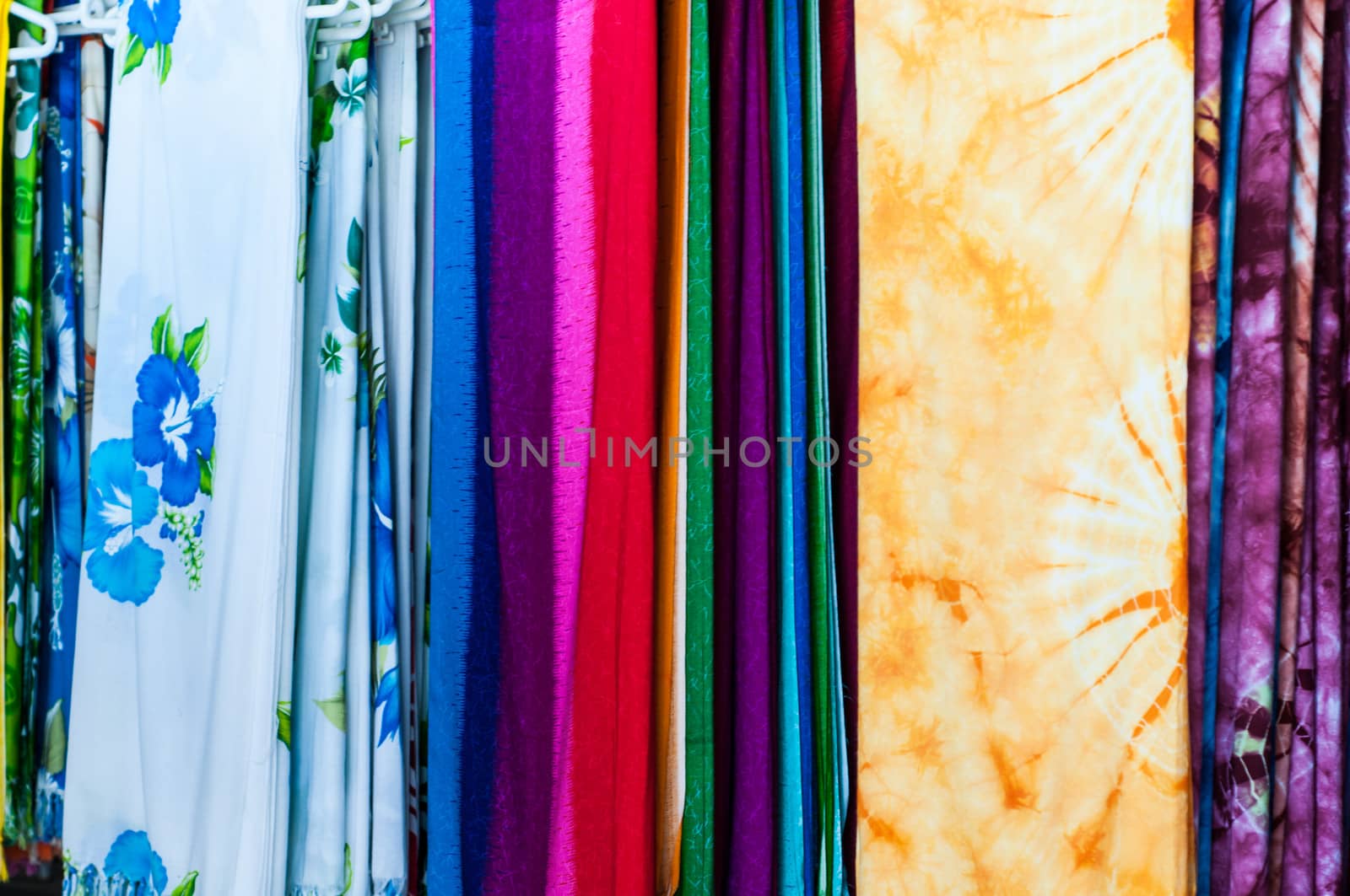 Stack of colorful fabric. Red, white, yellow, blue