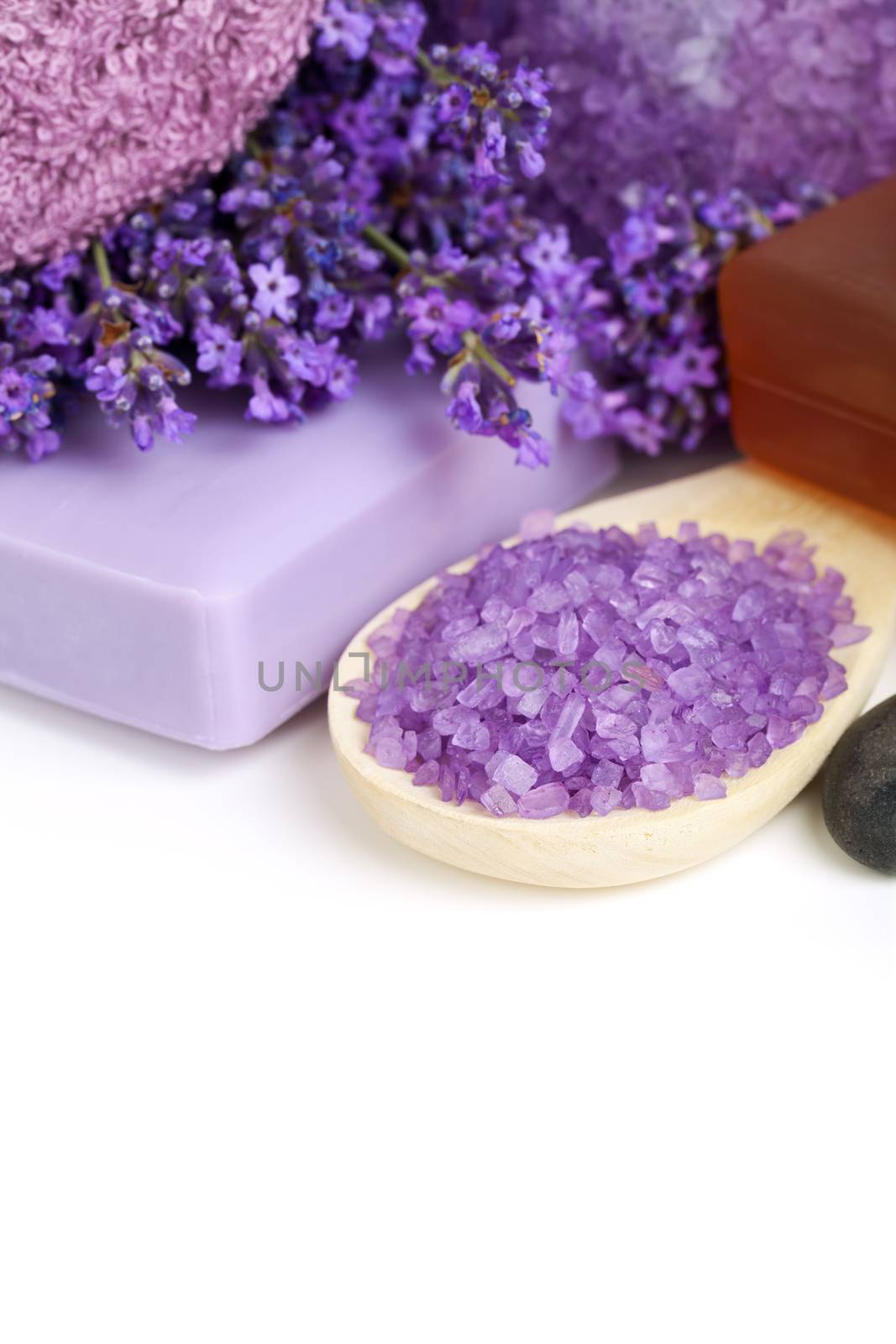 Lavender spa - flowers, salt, soap - health and beauty composition on white background. Empty room for text