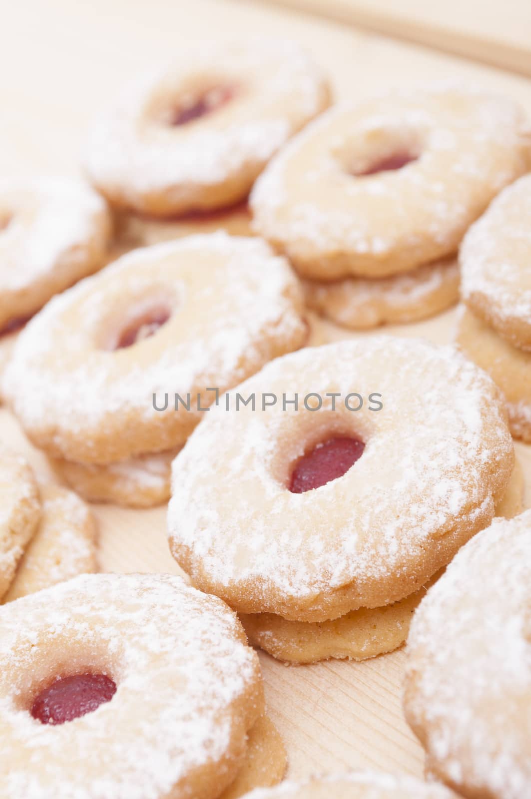 Closeup of Traditional Linzer Cookies on Wooden Board - Shallow Depth of Field