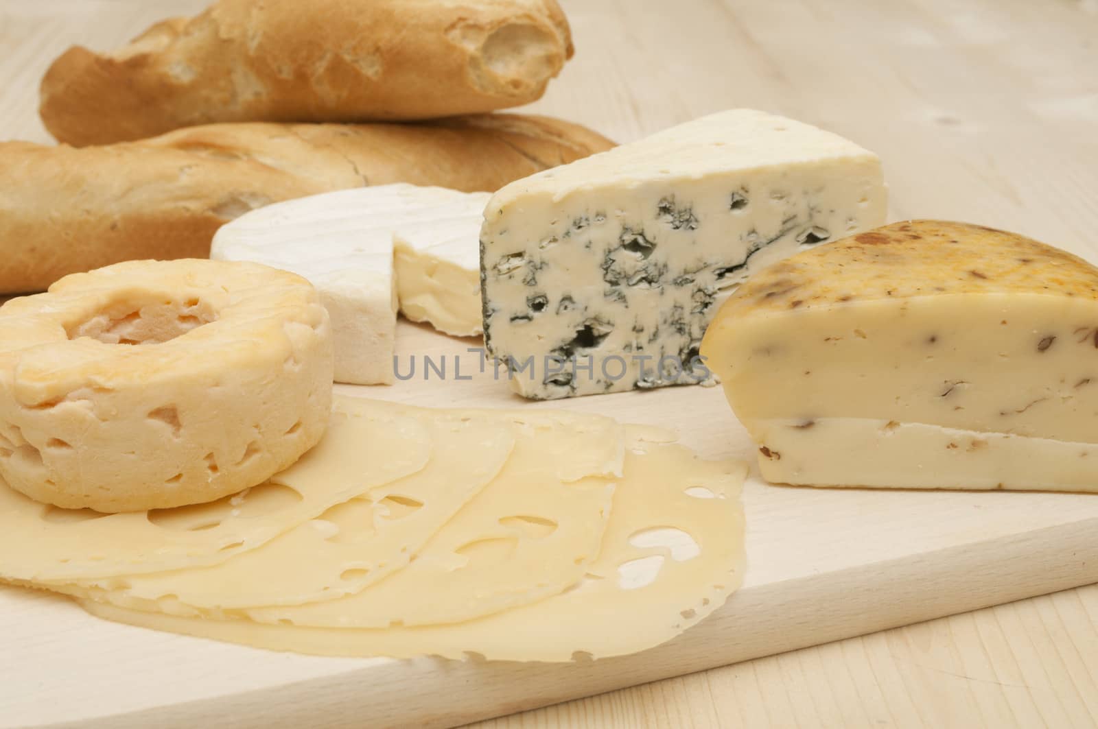 Various Types of Cheese on Wooden Chopping Board 