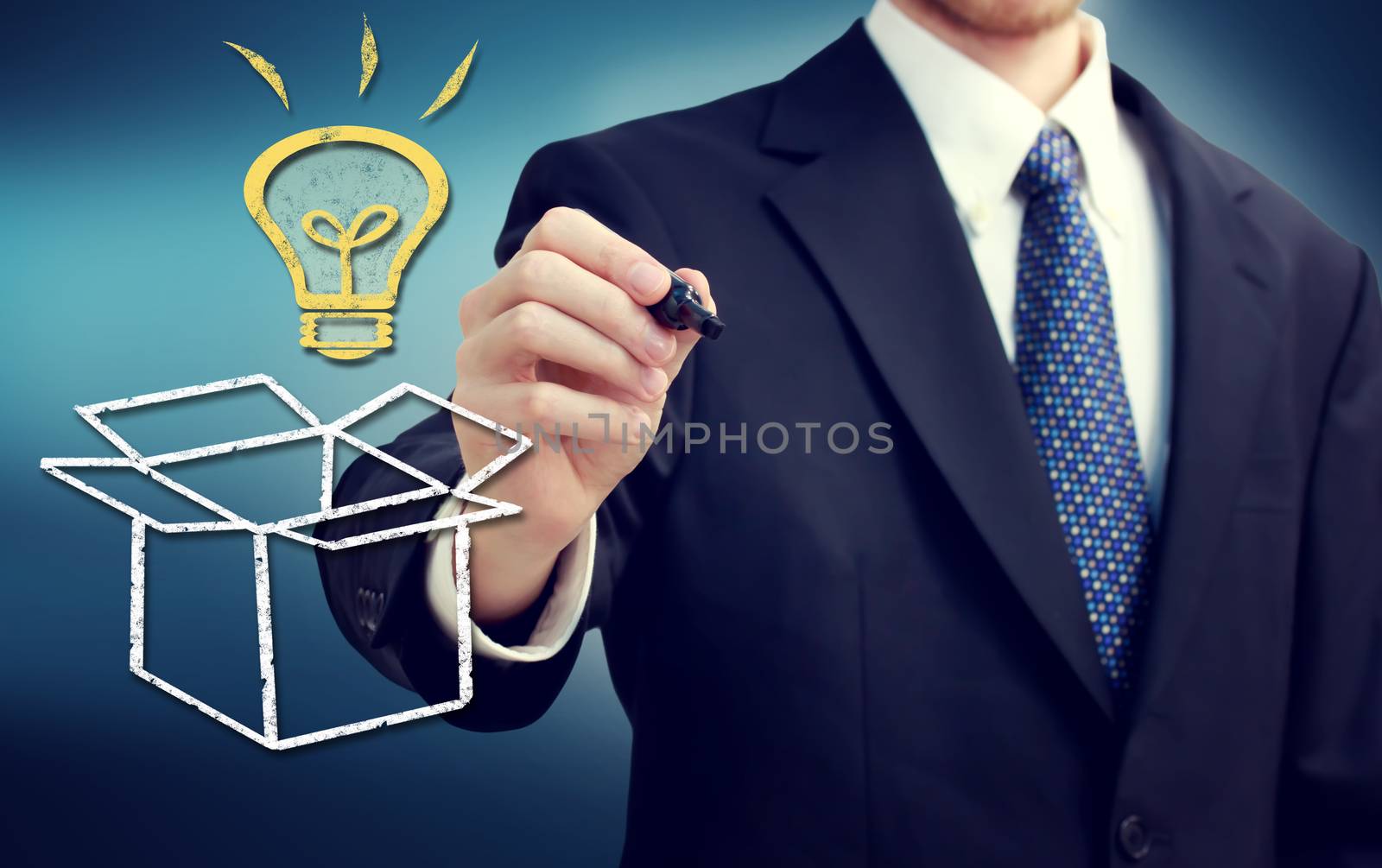 Businessman drawing thinking outside the box theme