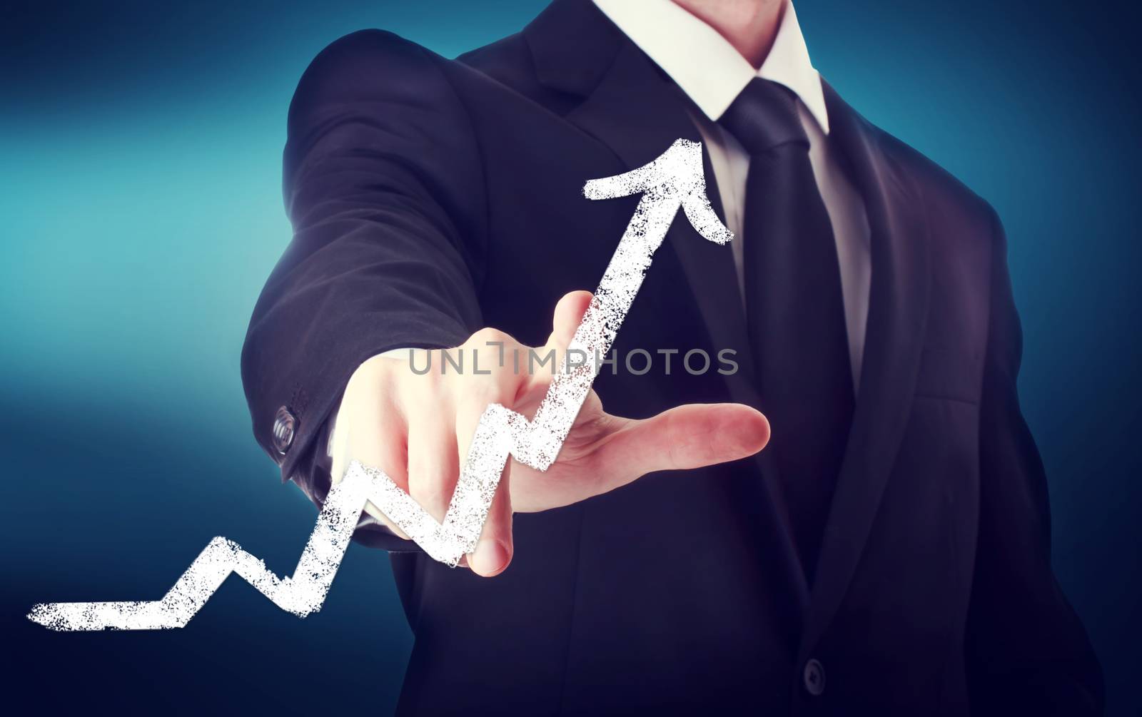 Businessman Touching a Arrow Indicating Growth on navy blue background