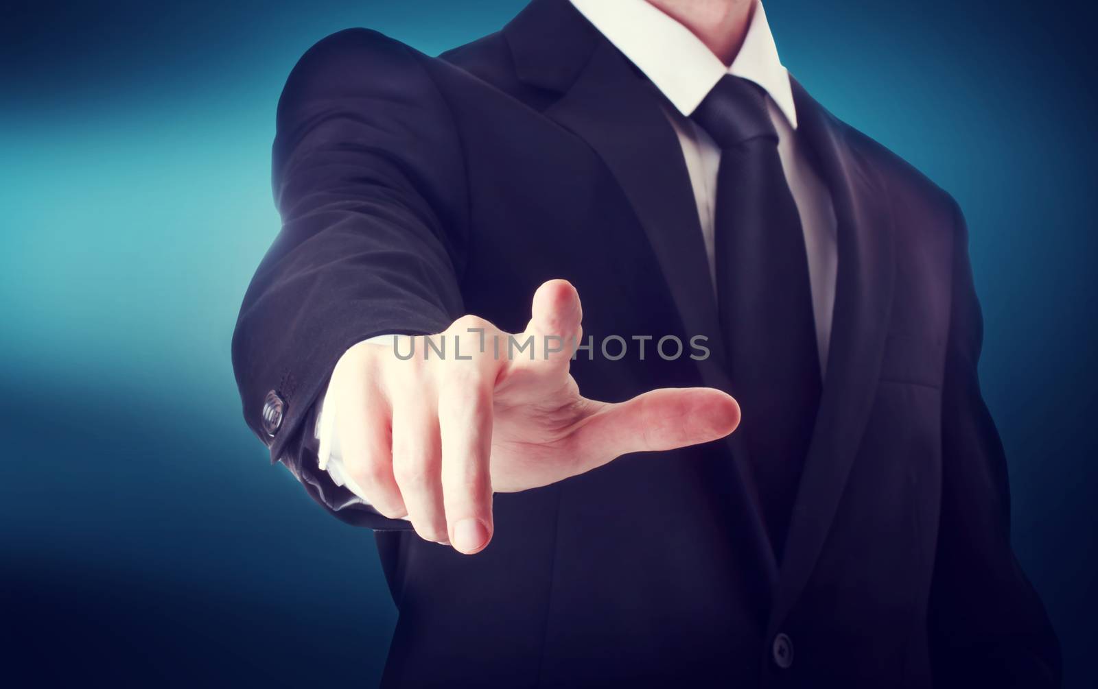 Business man with pointing to something or touching a touch screen by melpomene