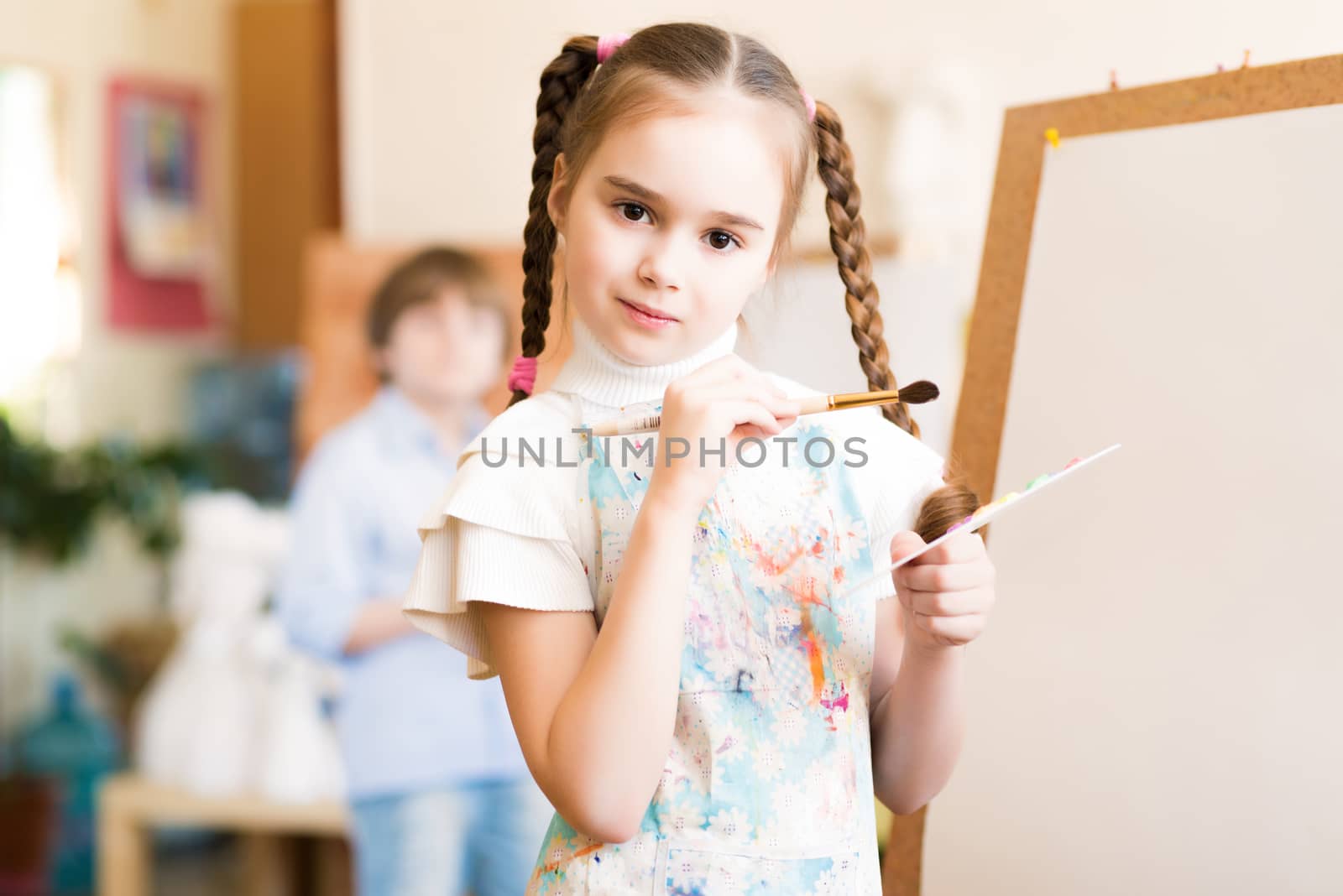 portrait of a girl standing next to his easel, a drawing lesson