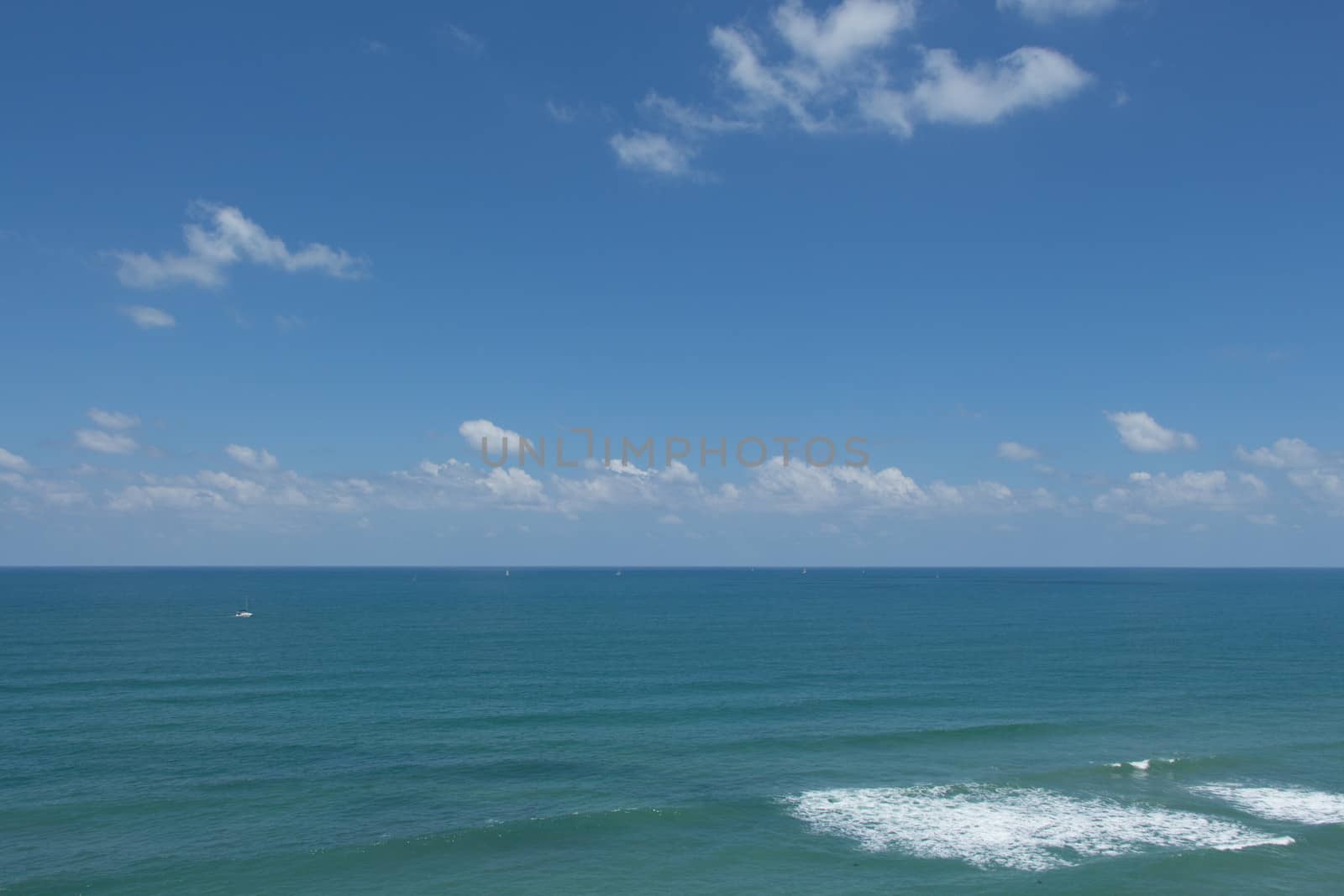 The blue sea under a beautiful blue sky.