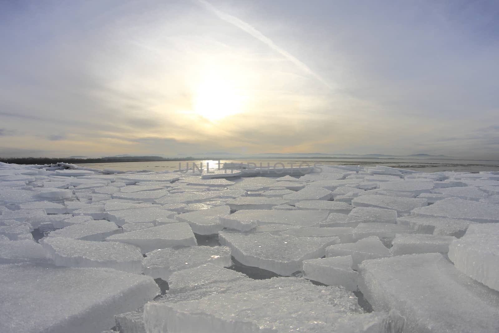 Austria frozen lake with pieces of ice in winter