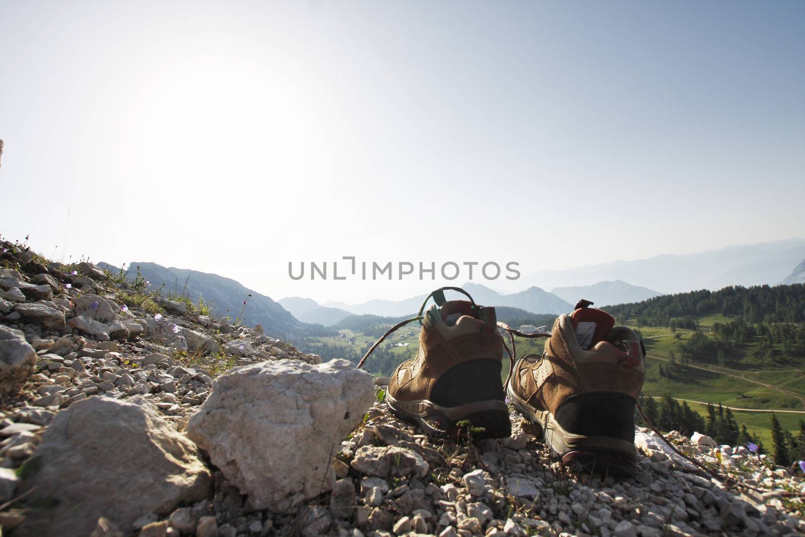 A pair of hiking shoes on the rock