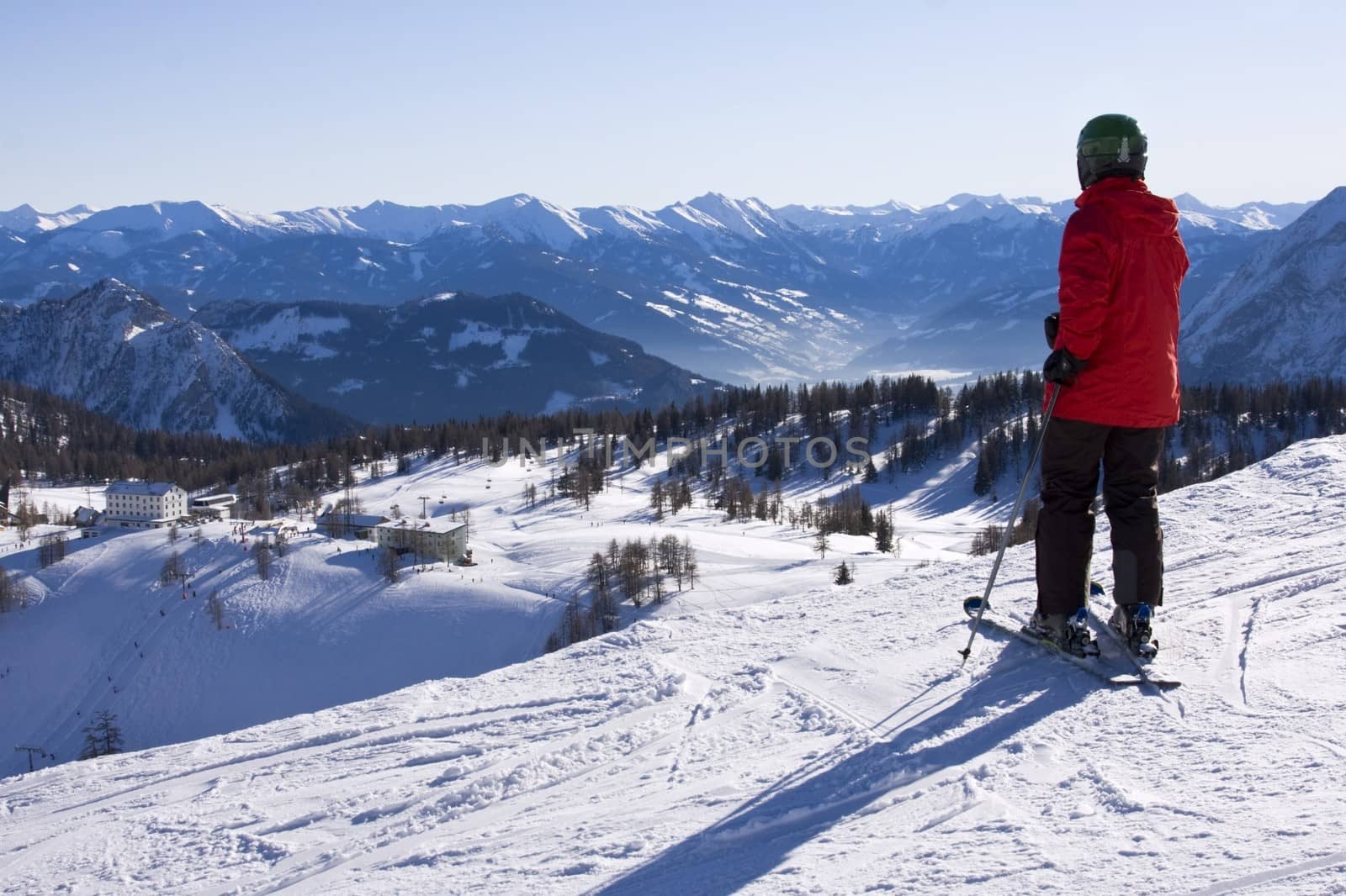 The skier watching beautiful montains panorama
