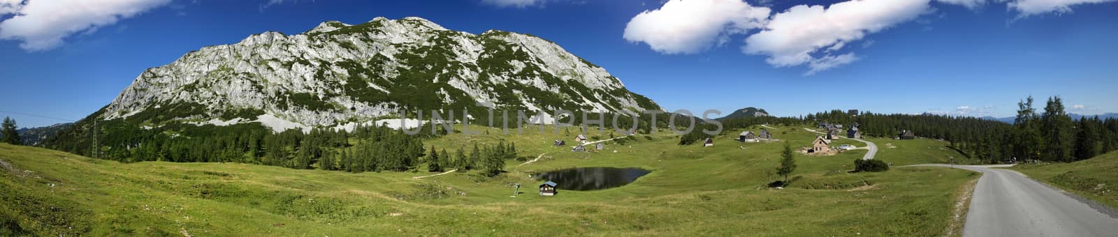 Very large panorama of the mountains and little pond