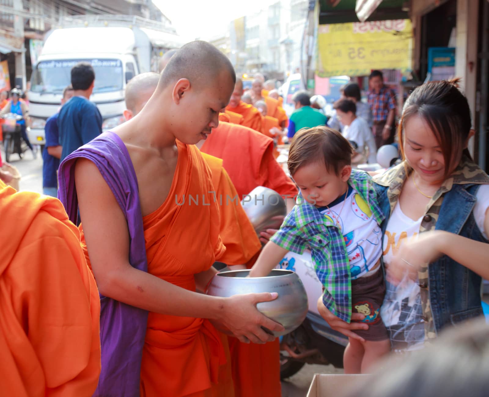 Phrae,Thailand - October 31,2012 : Unidentified Buddhist monks is given food offering from people at the morning on End of Buddhist Lent Day. on october 31, 2011 in Muang, Phrae, Thailand.