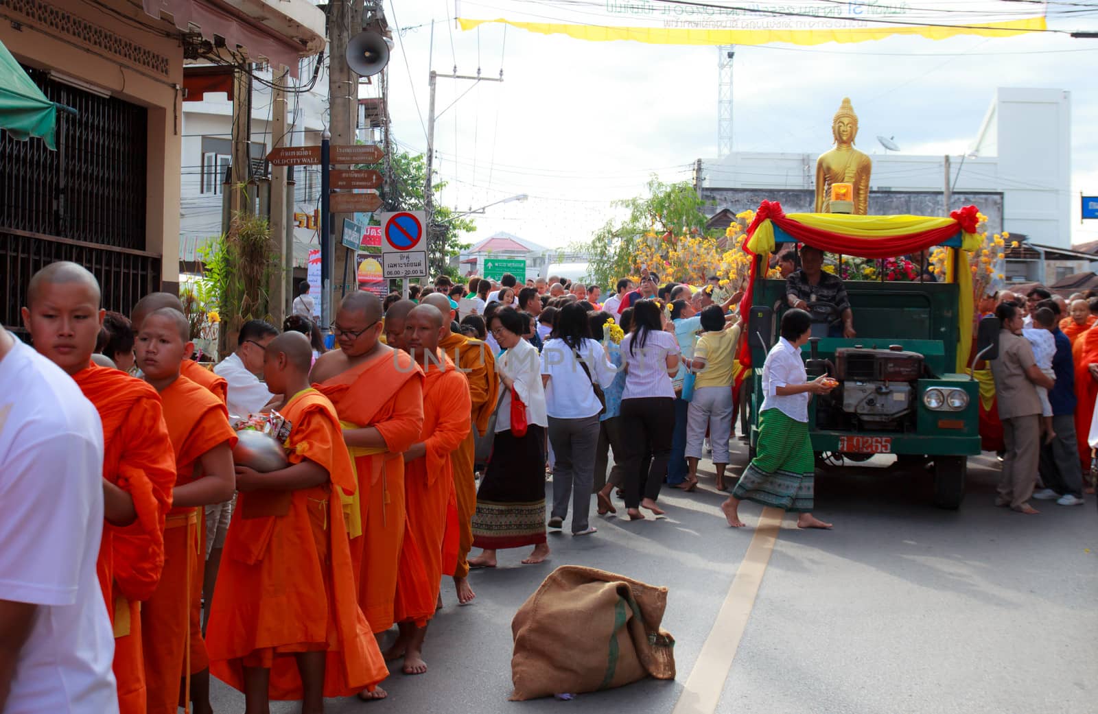 Phrae,Thailand - October 31,2012 : Unidentified Buddhist monks is given food offering from people at the morning on End of Buddhist Lent Day. on october 31, 2011 in Muang, Phrae, Thailand.