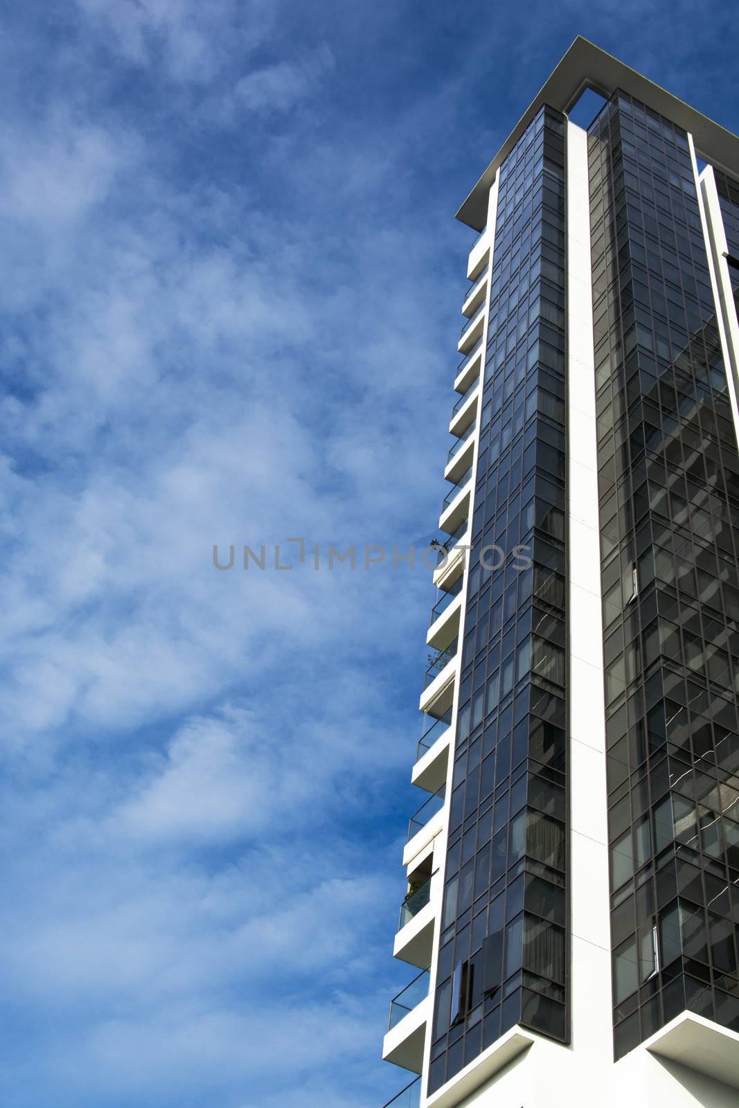 high rise apartments with sky background