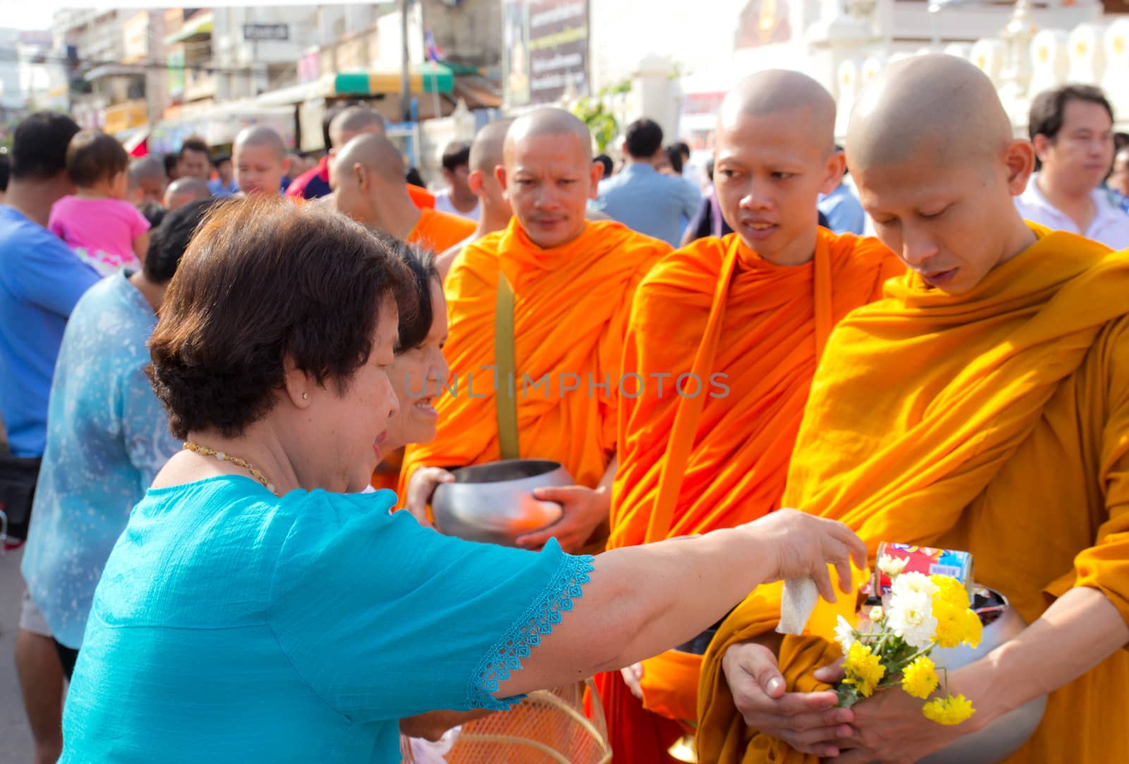 Phrae,Thailand - October 31,2012 : Unidentified Buddhist monks is given food offering from people at the morning on End of Buddhist Lent Day. on october 31, 2011 in Muang, Phrae, Thailand.