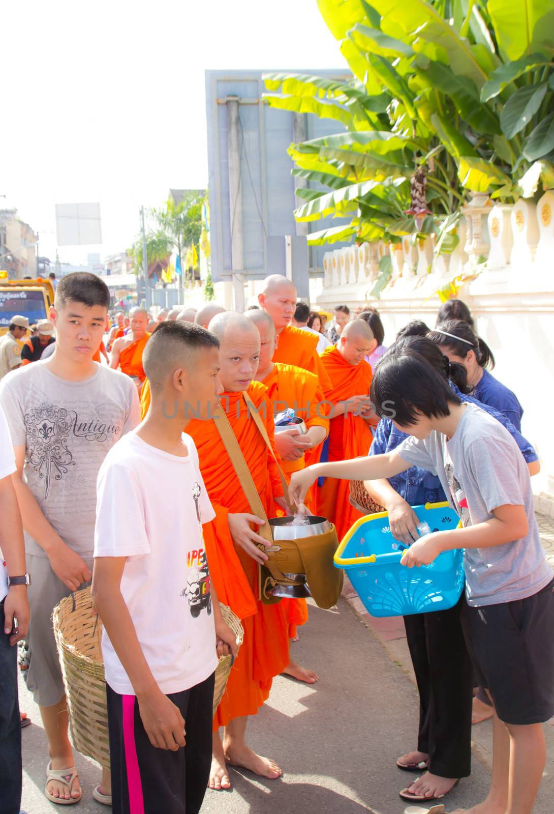 Phrae,Thailand - October 31,2012 : Unidentified Buddhist monks is given food offering from people at the morning on End of Buddhist Lent Day. on october 31, 2011 in Muang, Phrae, Thailand.