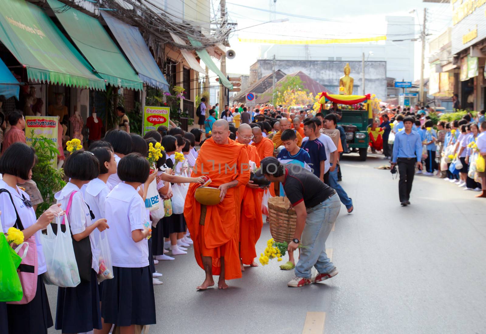 Phrae,Thailand - October 31,2012 : Unidentified Buddhist monks is given food offering from people at the morning on End of Buddhist Lent Day. on october 31, 2011 in Muang, Phrae, Thailand.