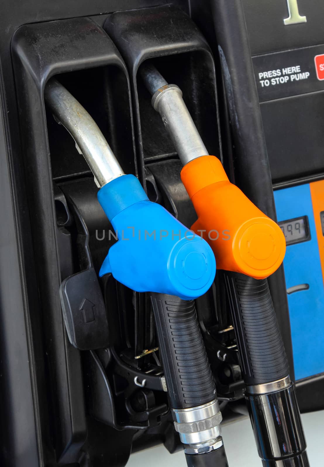 Gas pump nozzles in a service station