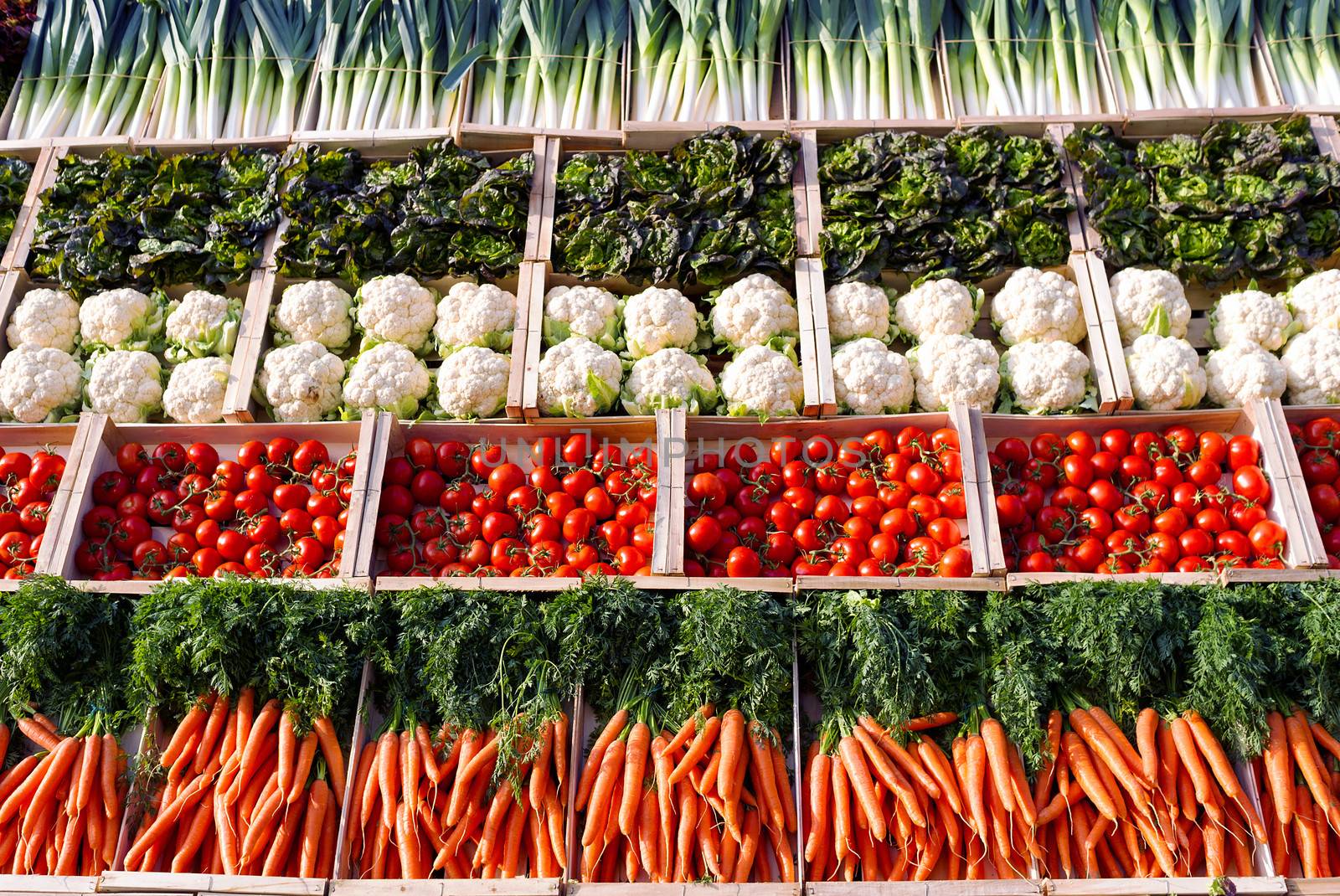 Many vegetables on shelfes in supermarket