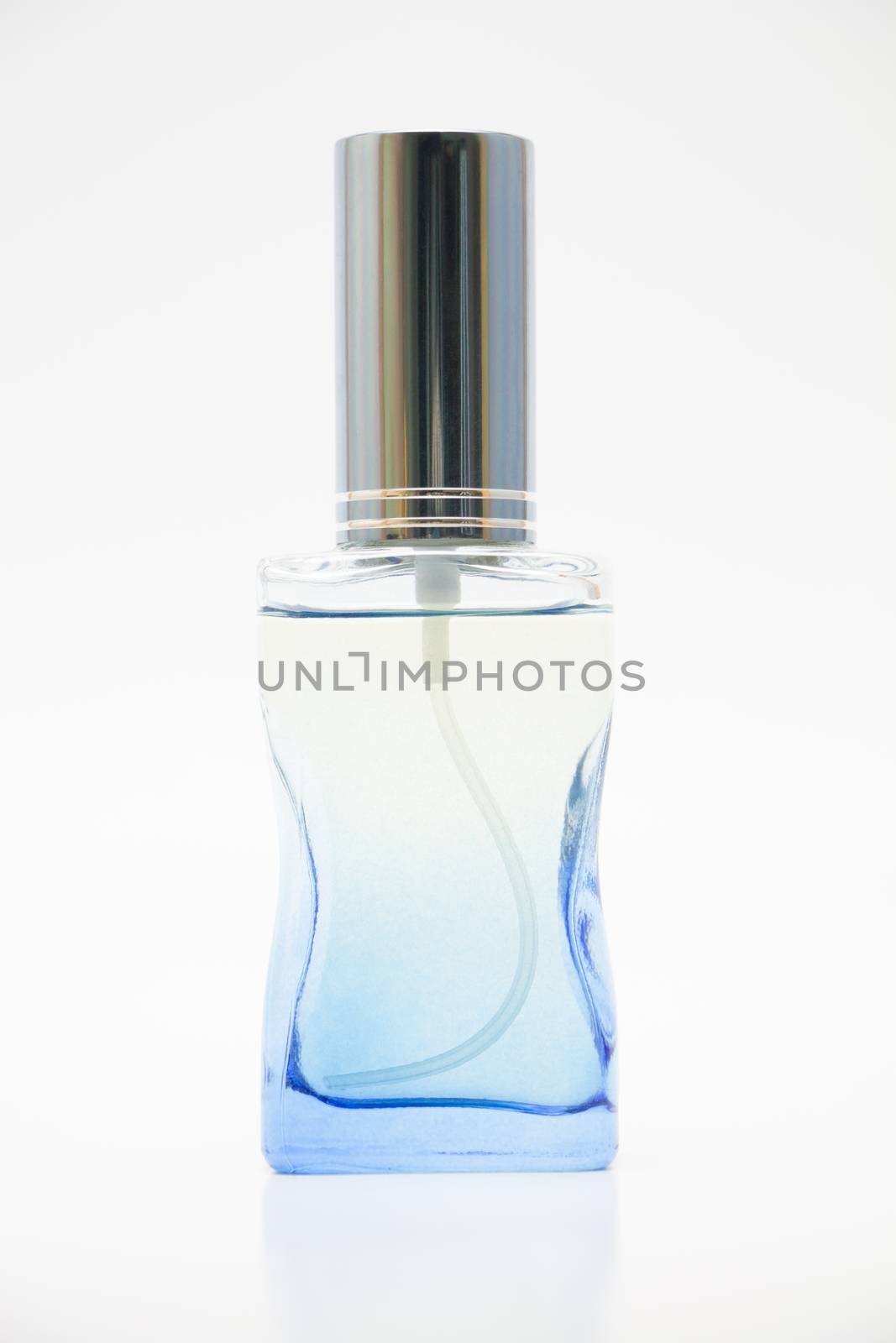 Glass blue perfume bottles on white background.