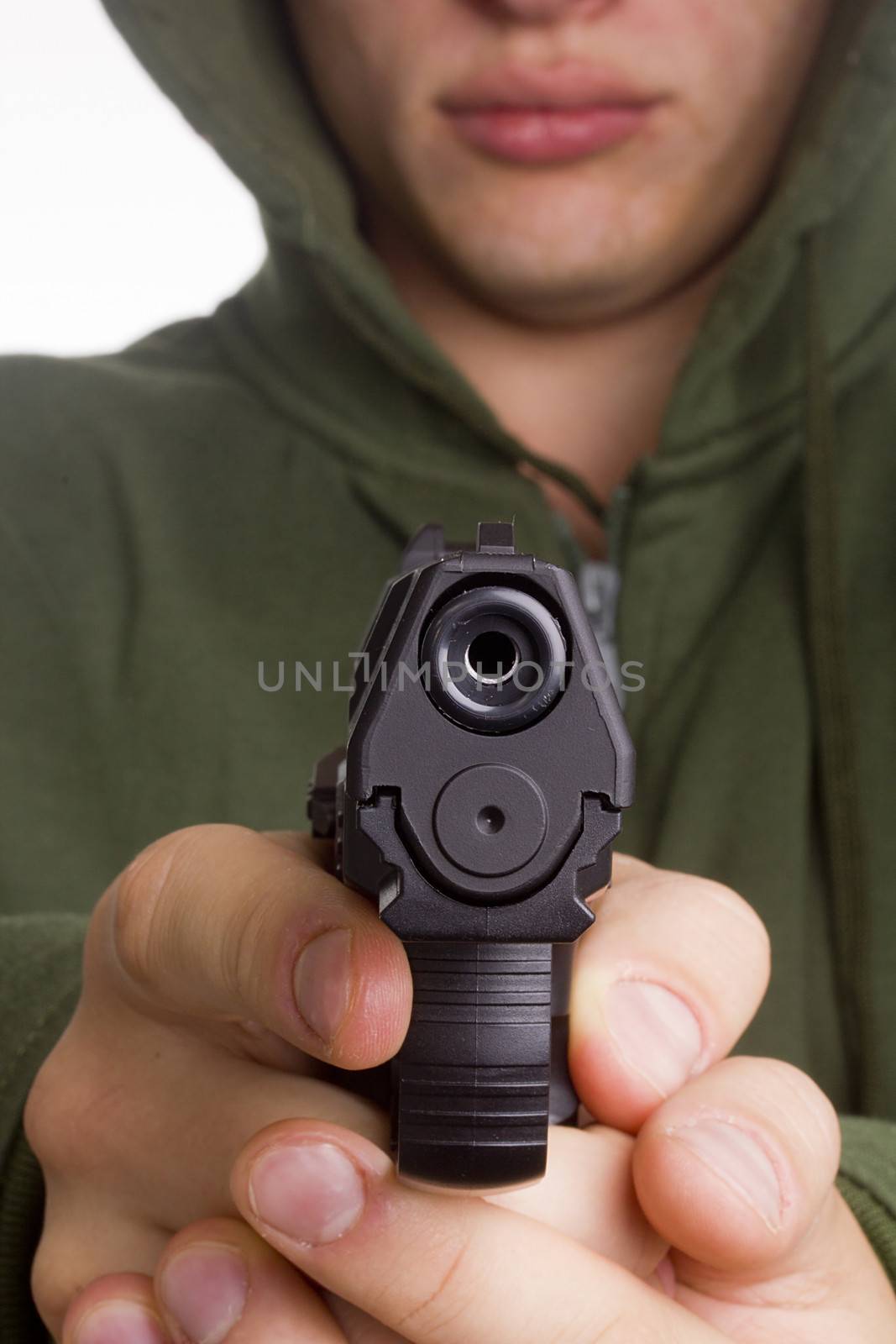 Gun in the hands of a gunman aimed shot.