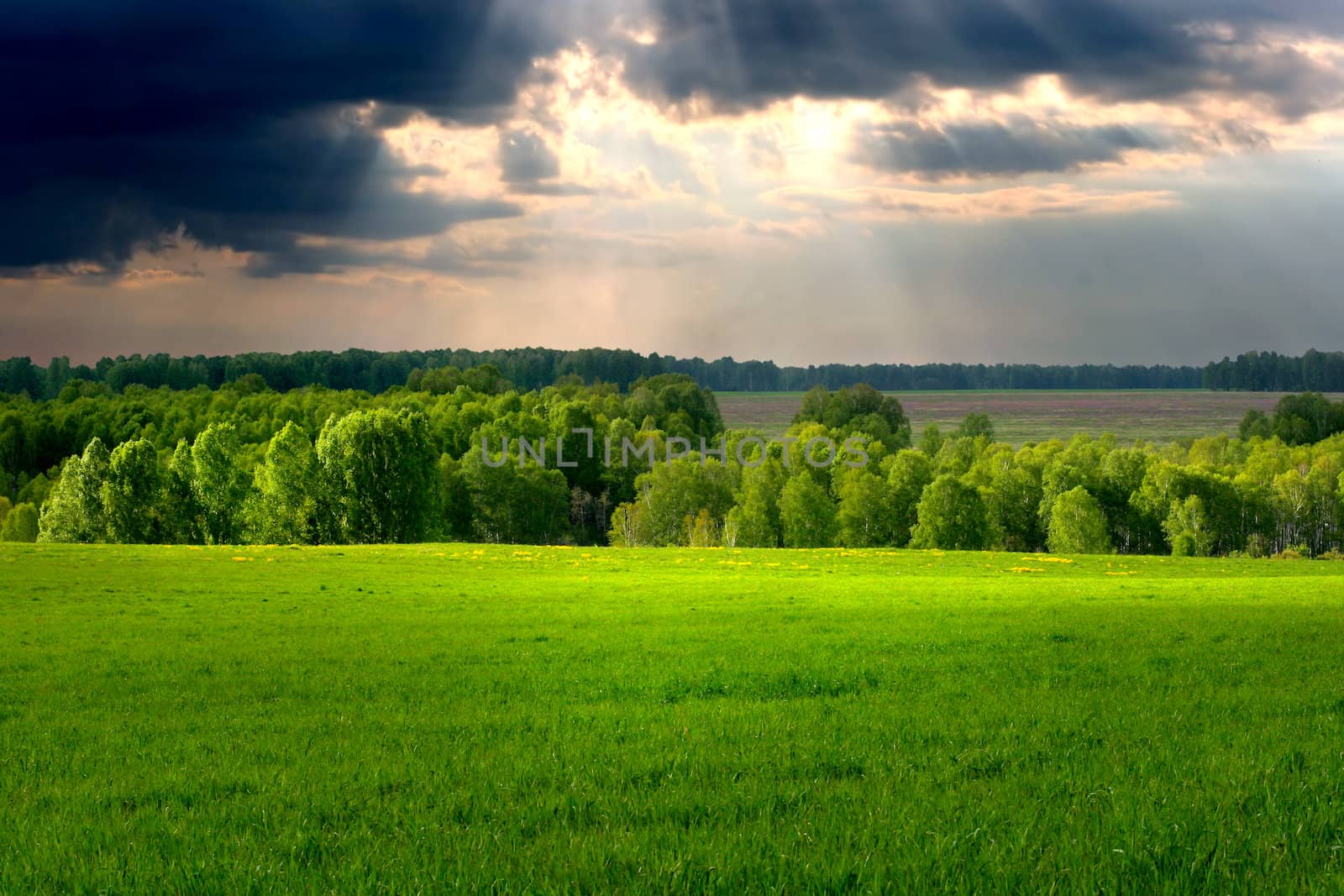 Dramatic cloudscape over village landscape