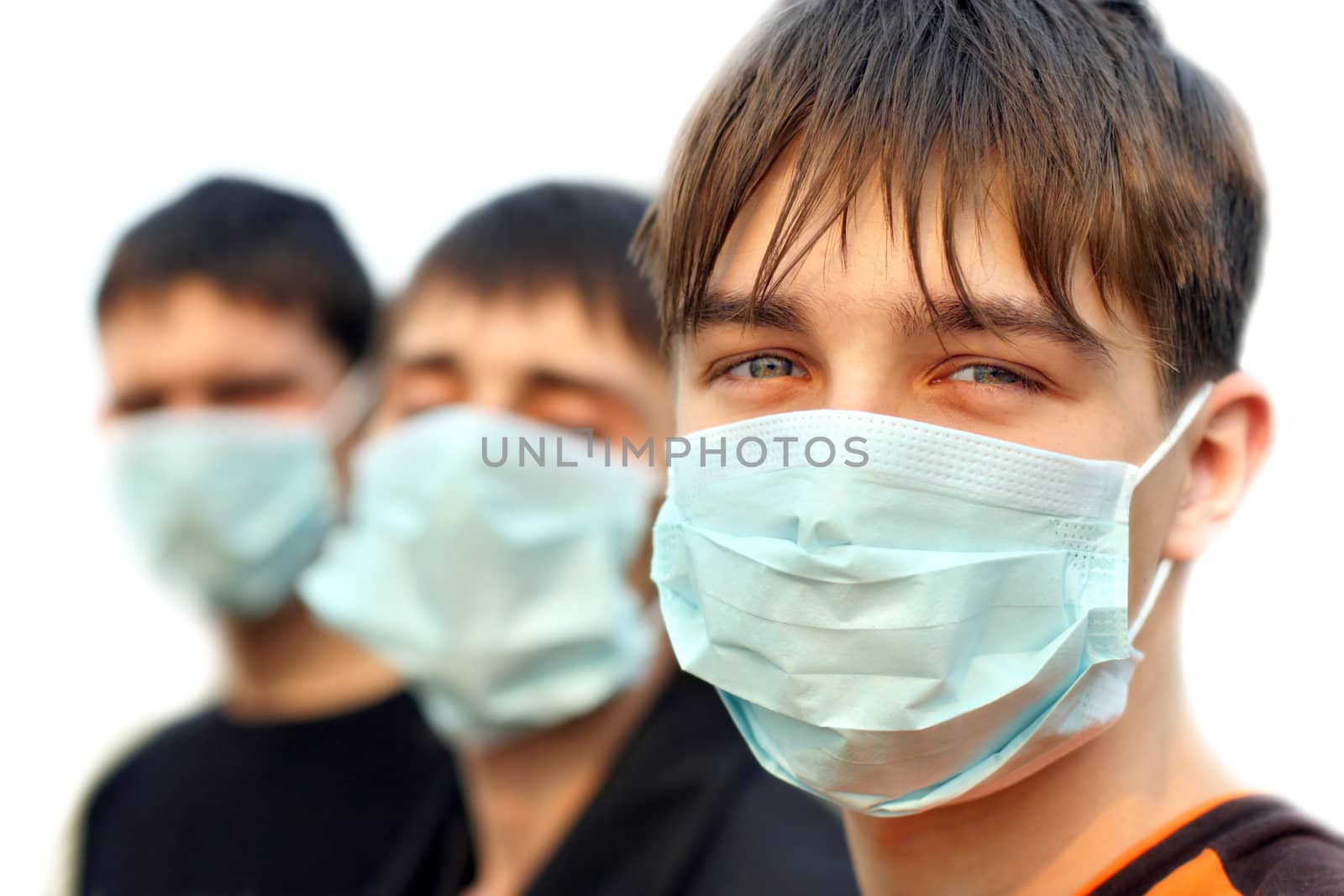 three teenagers in the mask isolated on white