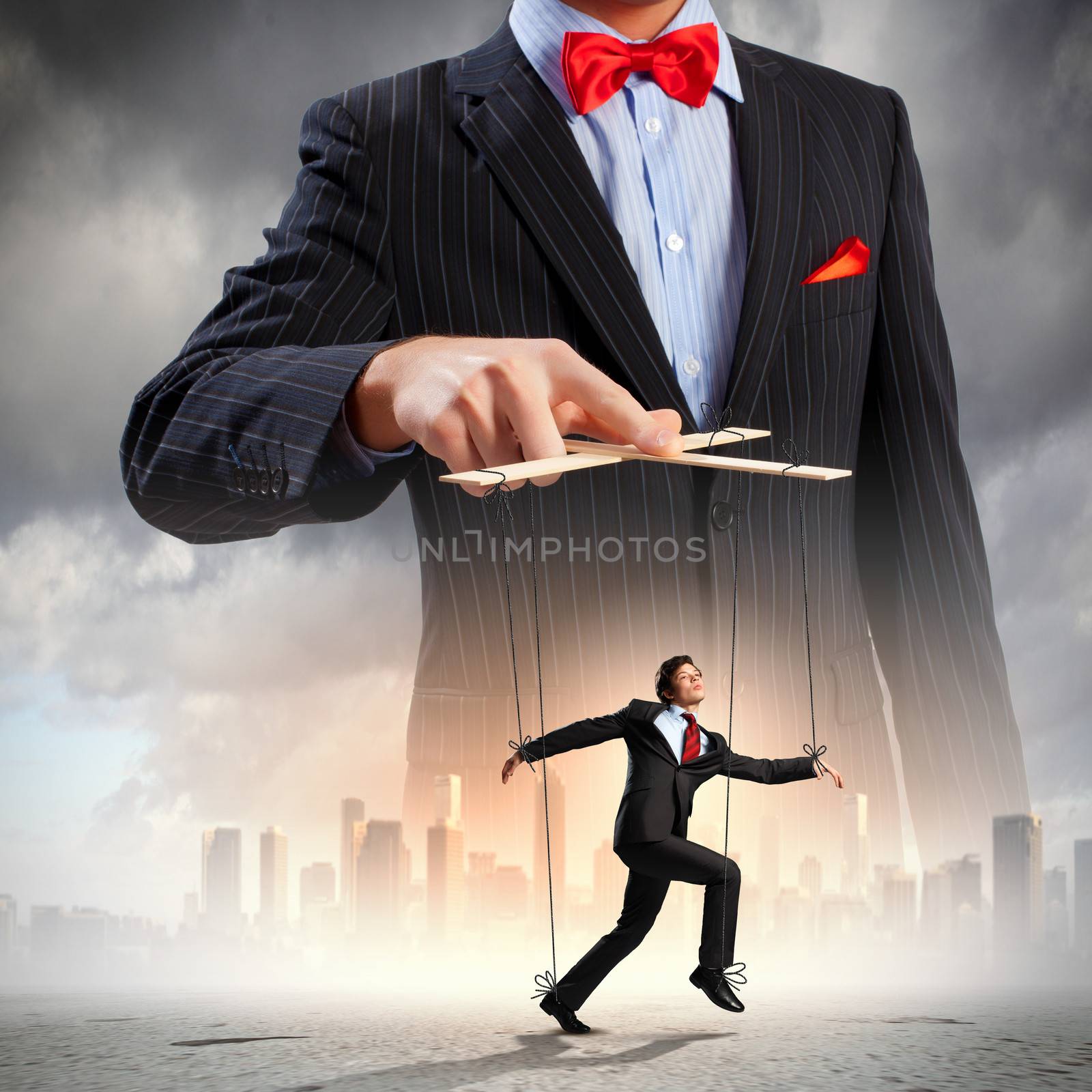 Image of young businessman puppeteer. Leadership concept