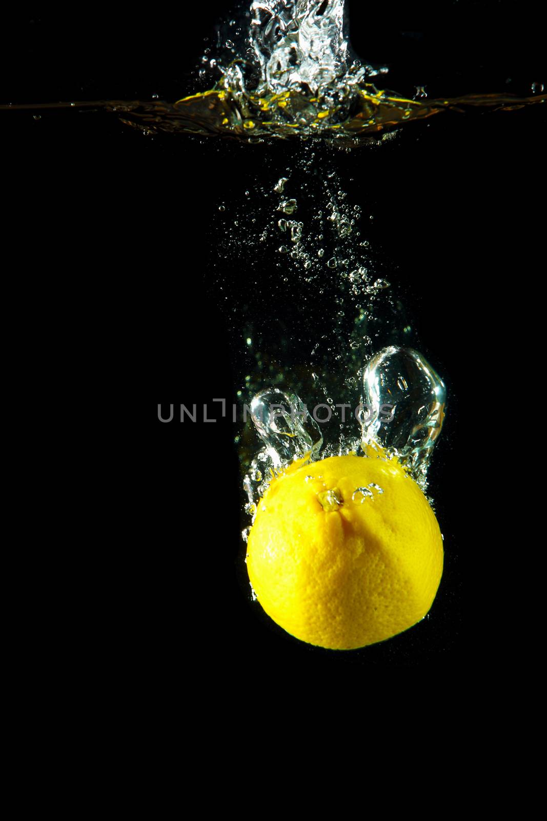 Bright and juicy lemon under water. Fresh and healthy meal