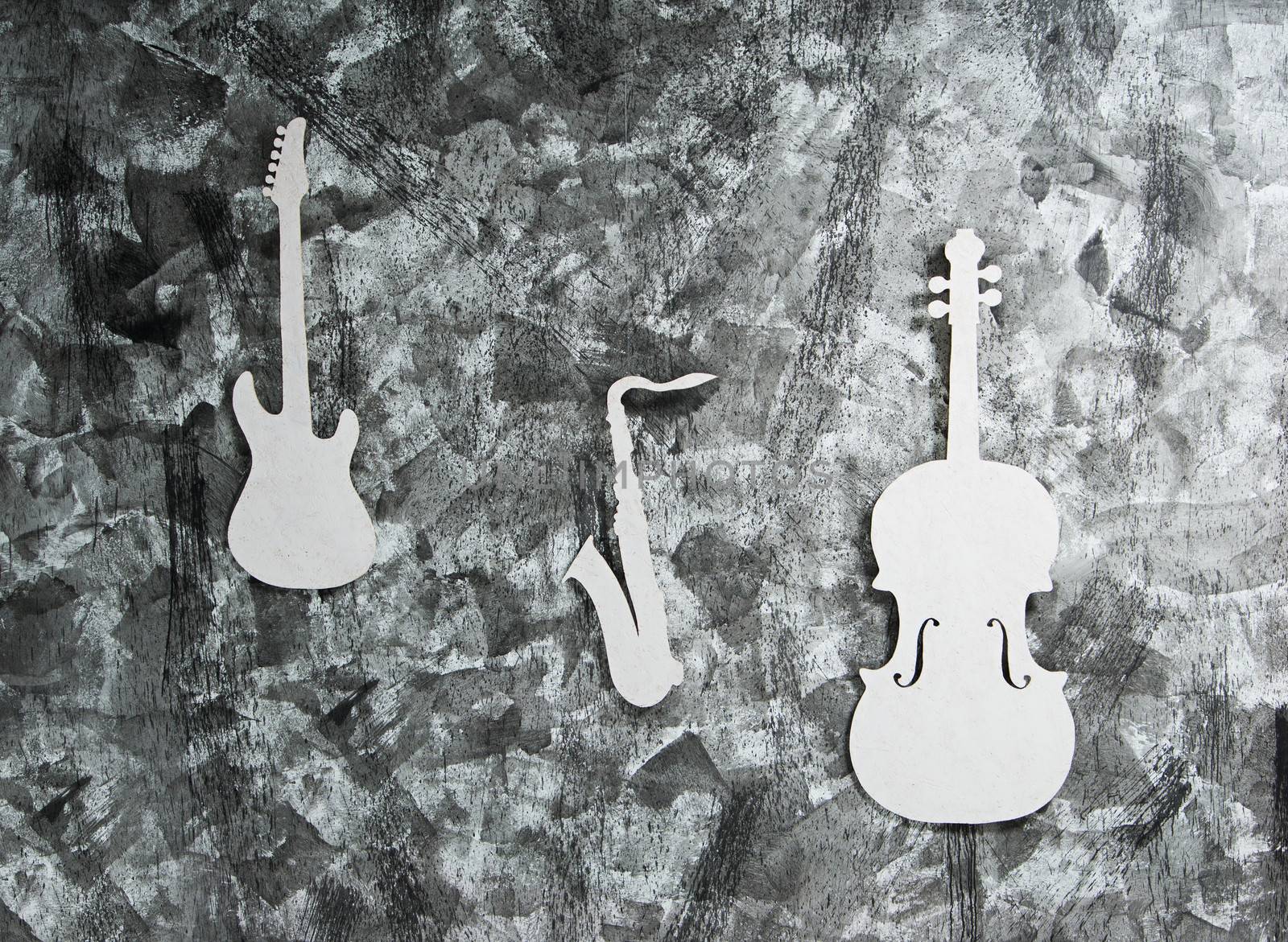 white musical instruments on a grey grunge background