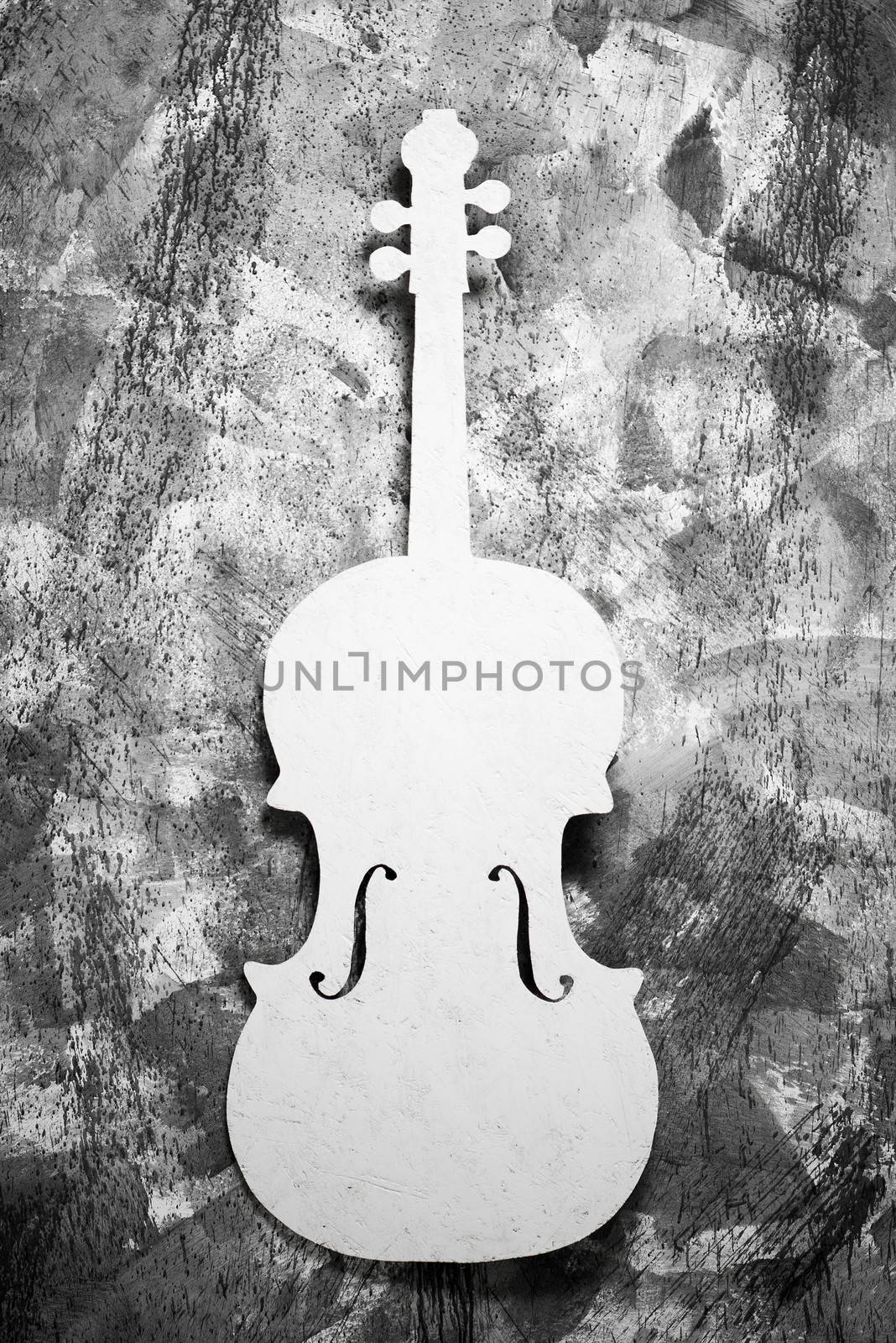 white cello on a grey grunge background
