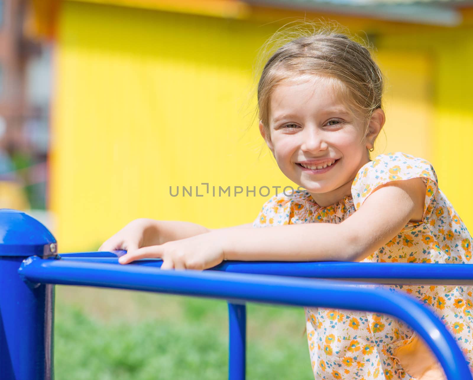 smiling cute little girl on the playground