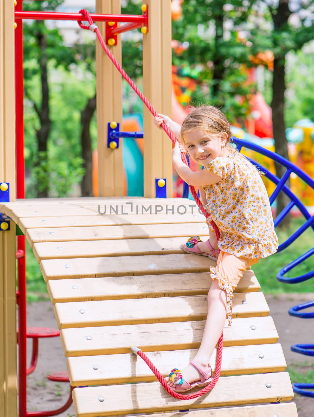 cute little girl on the playground, outdoors