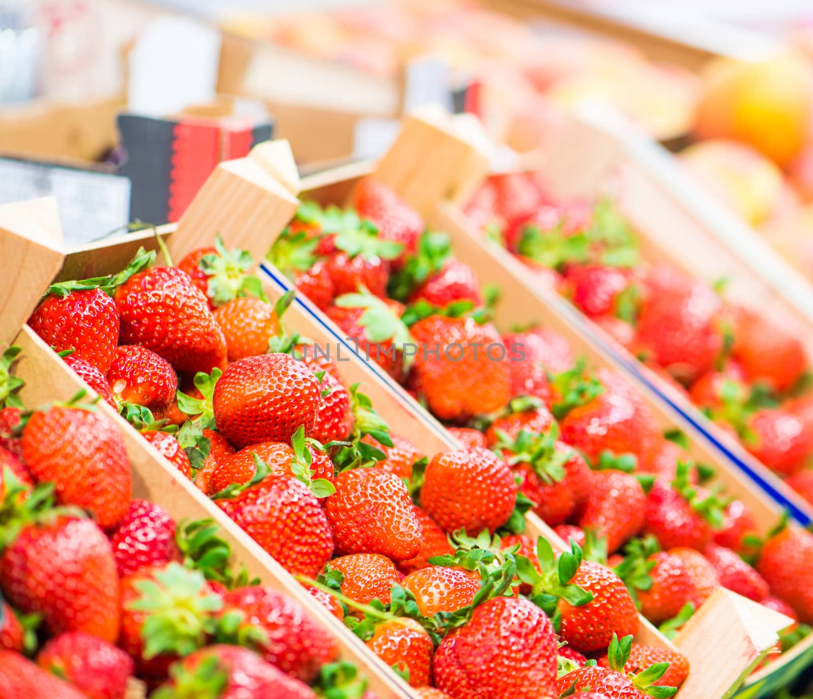 Strawberries in boxes on the market