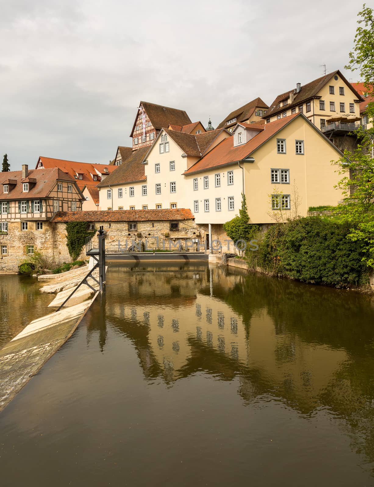 View of the old town of Schwabisch Hall inside city walls and with the RIver Kocher running alongside the buildings.