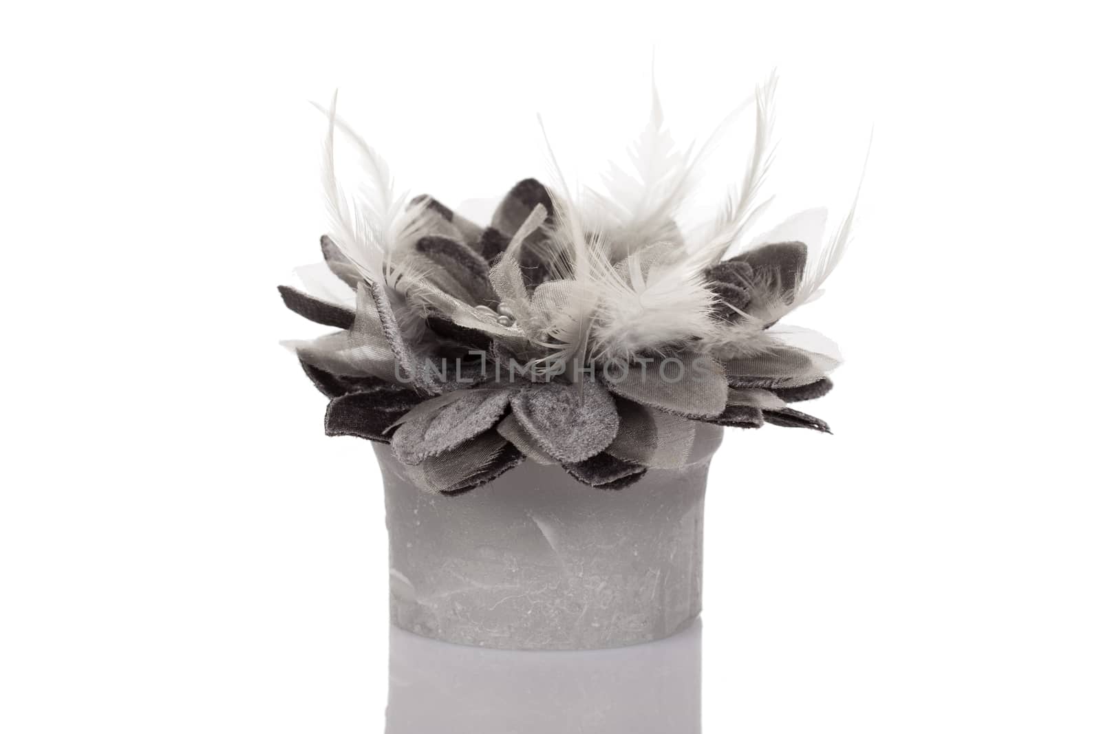 Feathers, beads and candle isolated on white background.