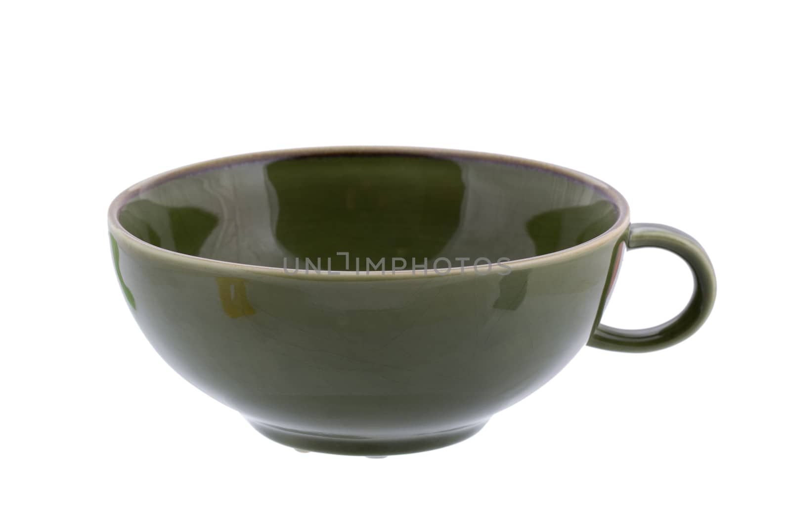 Green ceramic cup isolated on white background close up.