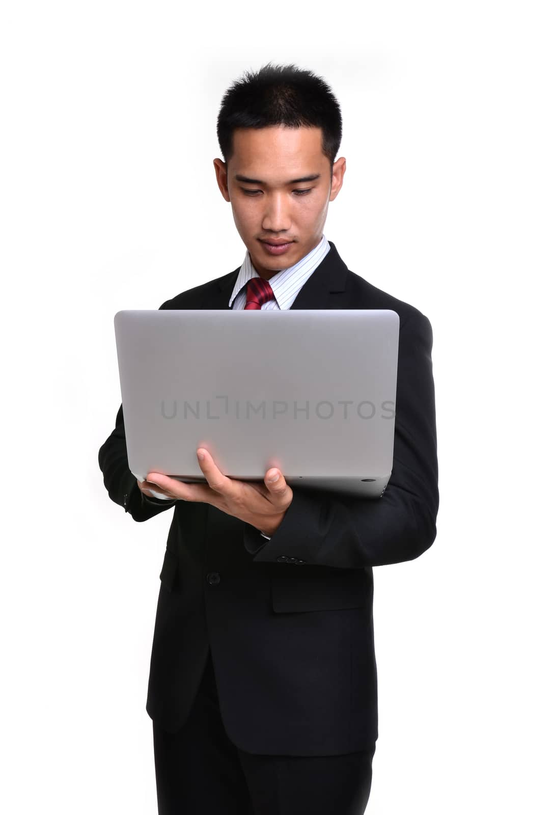 business man with laptop isolated  by anankkml