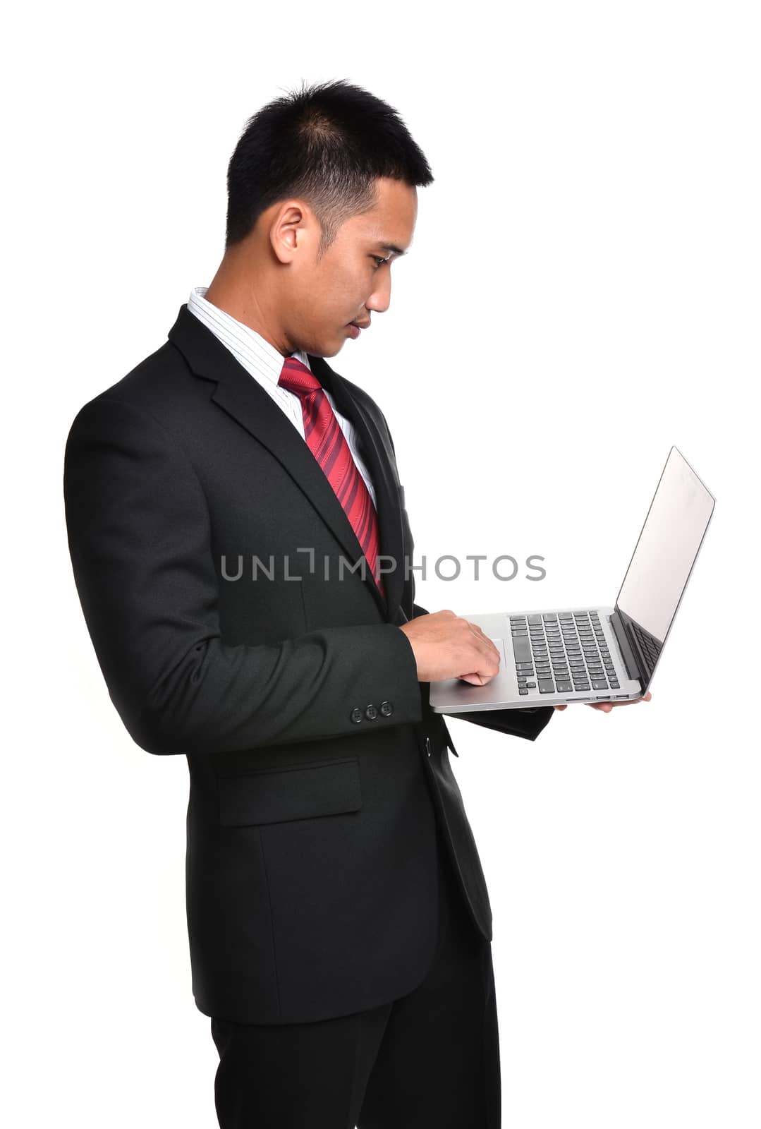 business man with laptop isolated  by anankkml