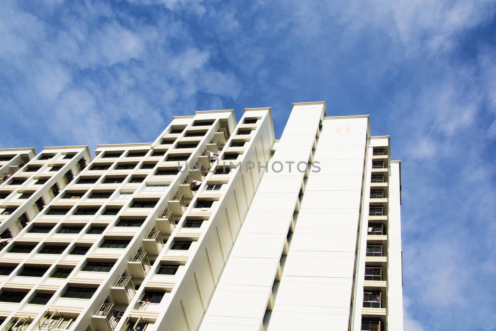 high rise apartments with sky background