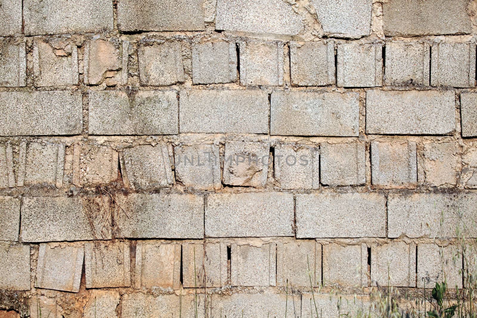 an old stone brick wall on a rural house in spain