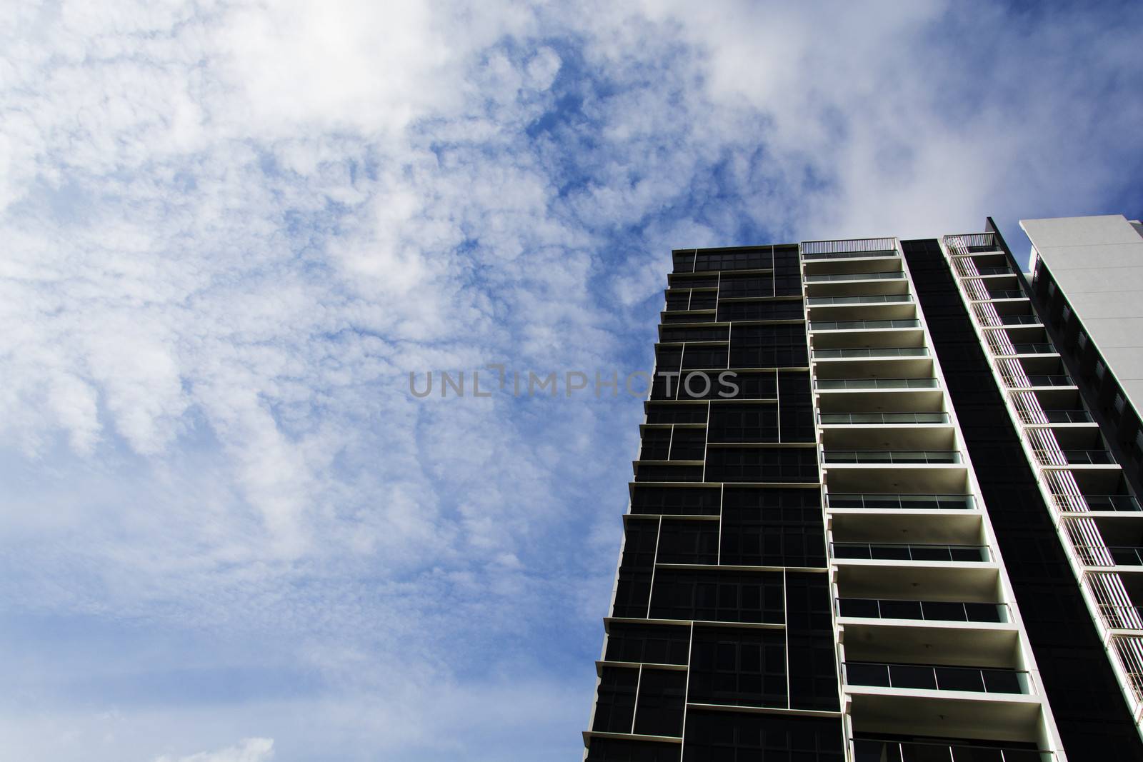 high rise apartments with clear blue sky