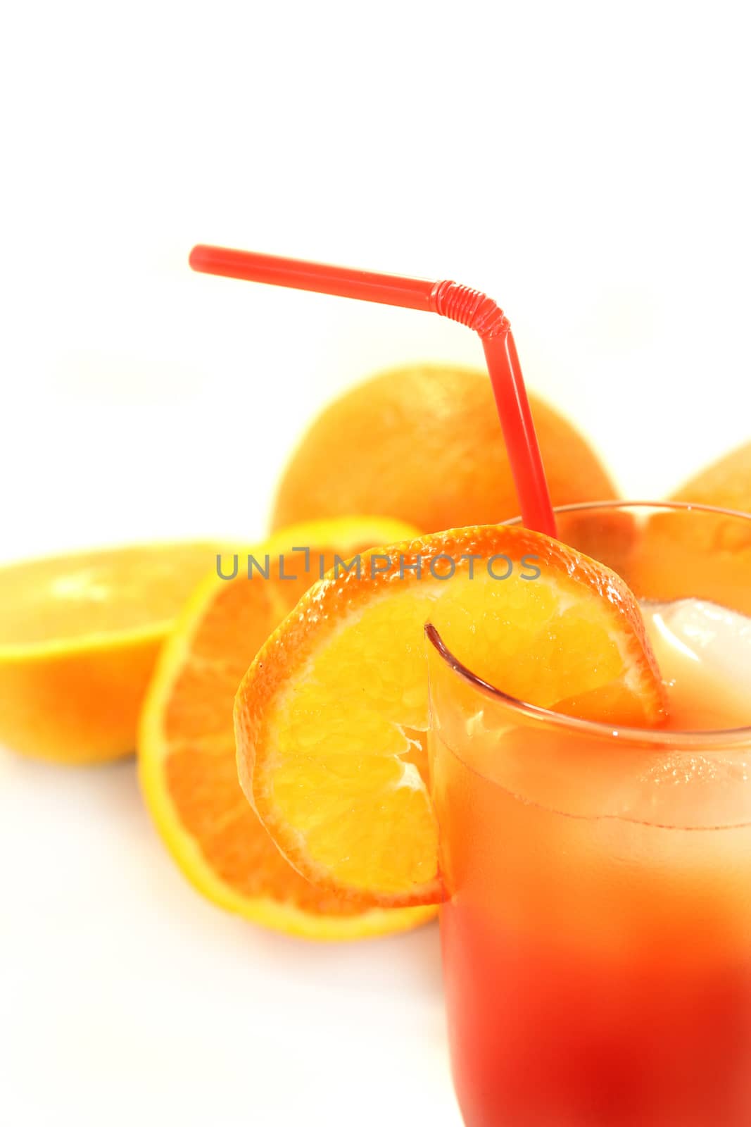 a glass of Campari orange and ice cubes