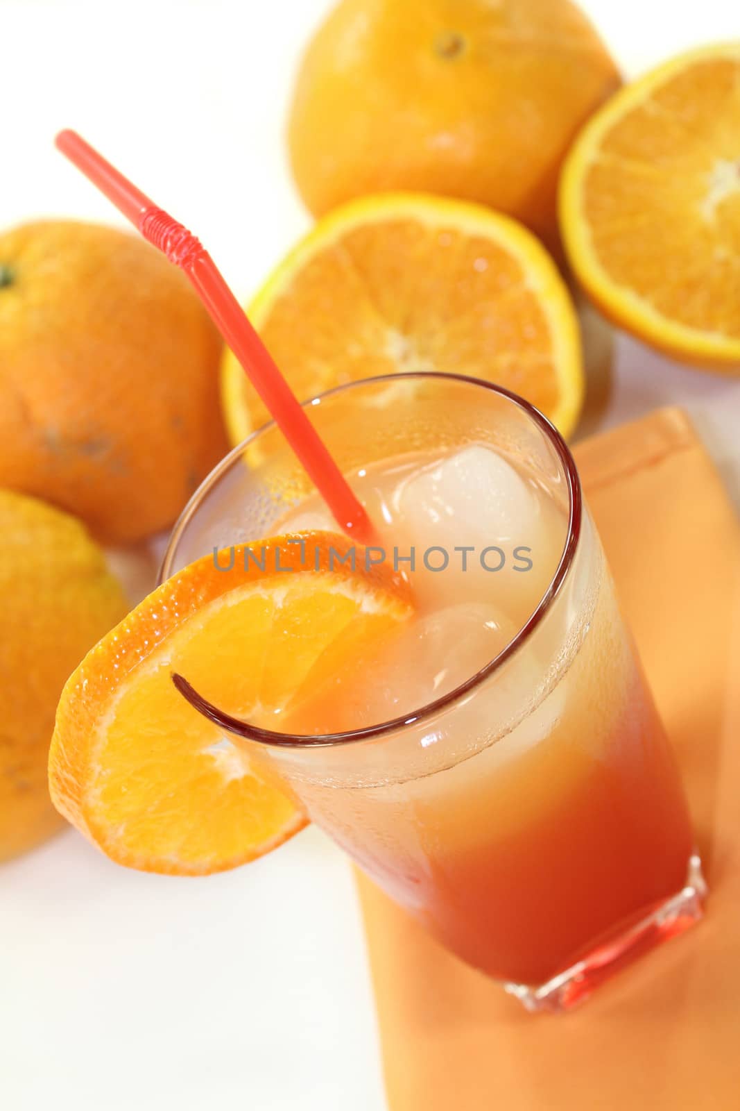 a glass of Campari orange and ice cubes