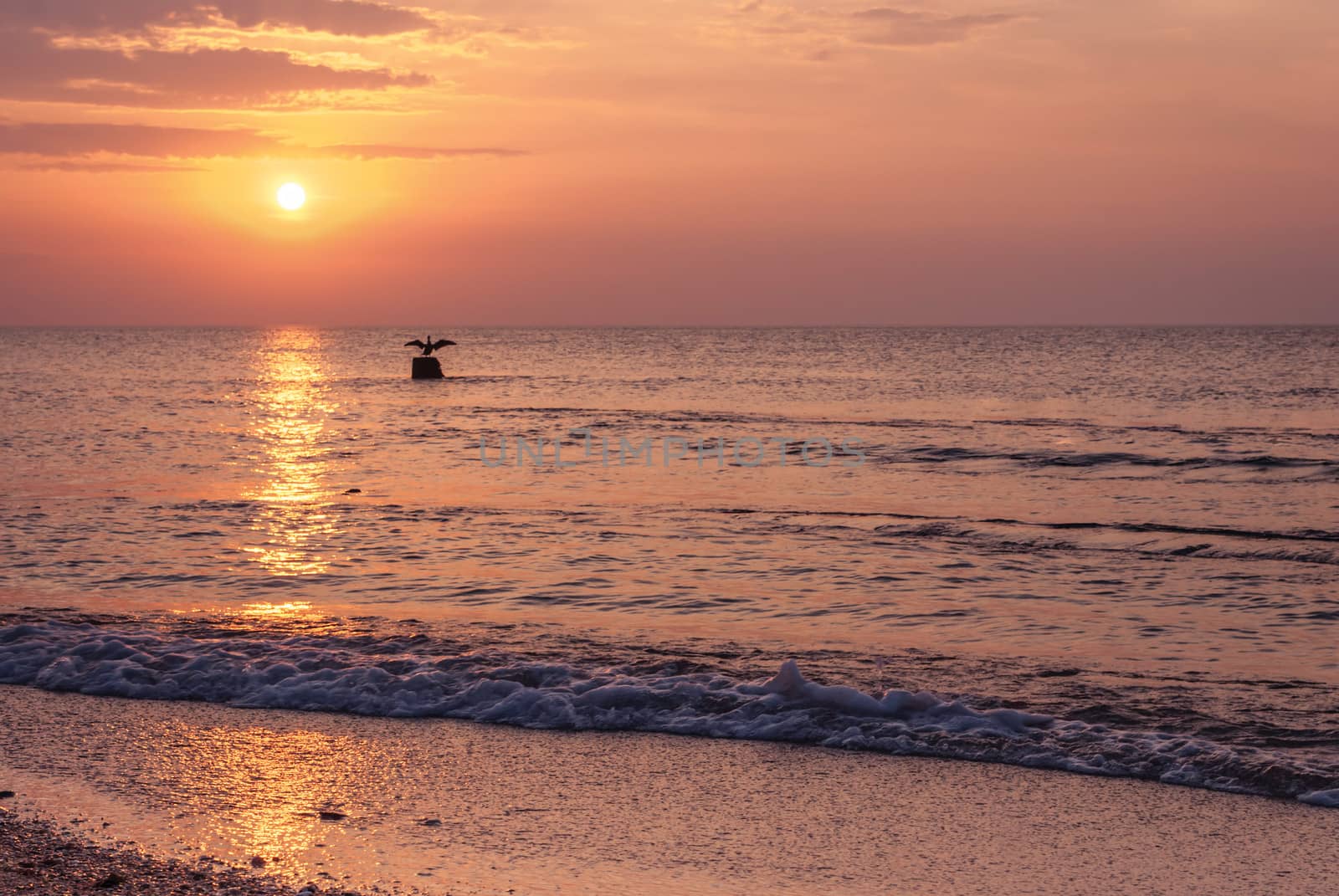 Beautiful seascape with orange warm sunrise, vacation concept