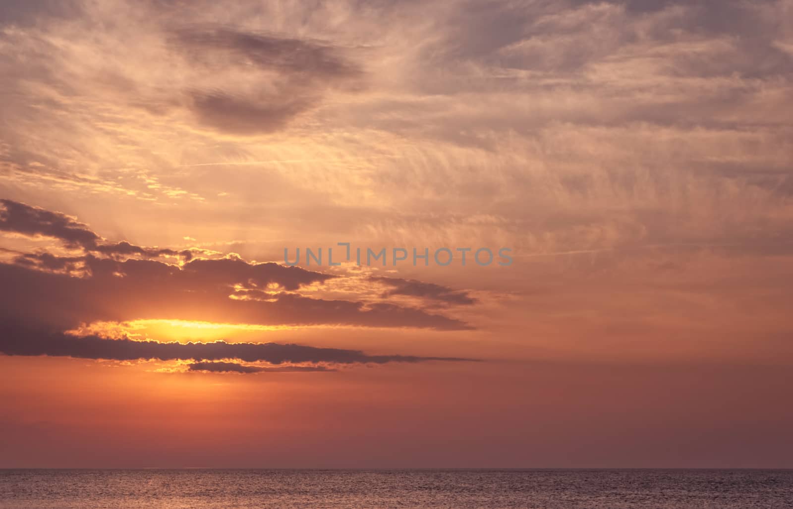 Beautiful seascape with orange warm sunrise, vacation concept