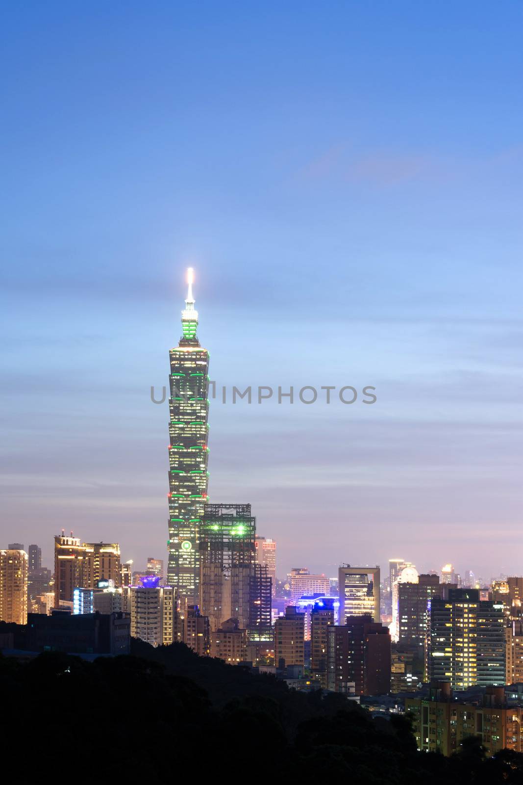 Taipei city night with famous landmark, 101 skyscraper, under blue and dramatic colorful sky in Taiwan, Asia.